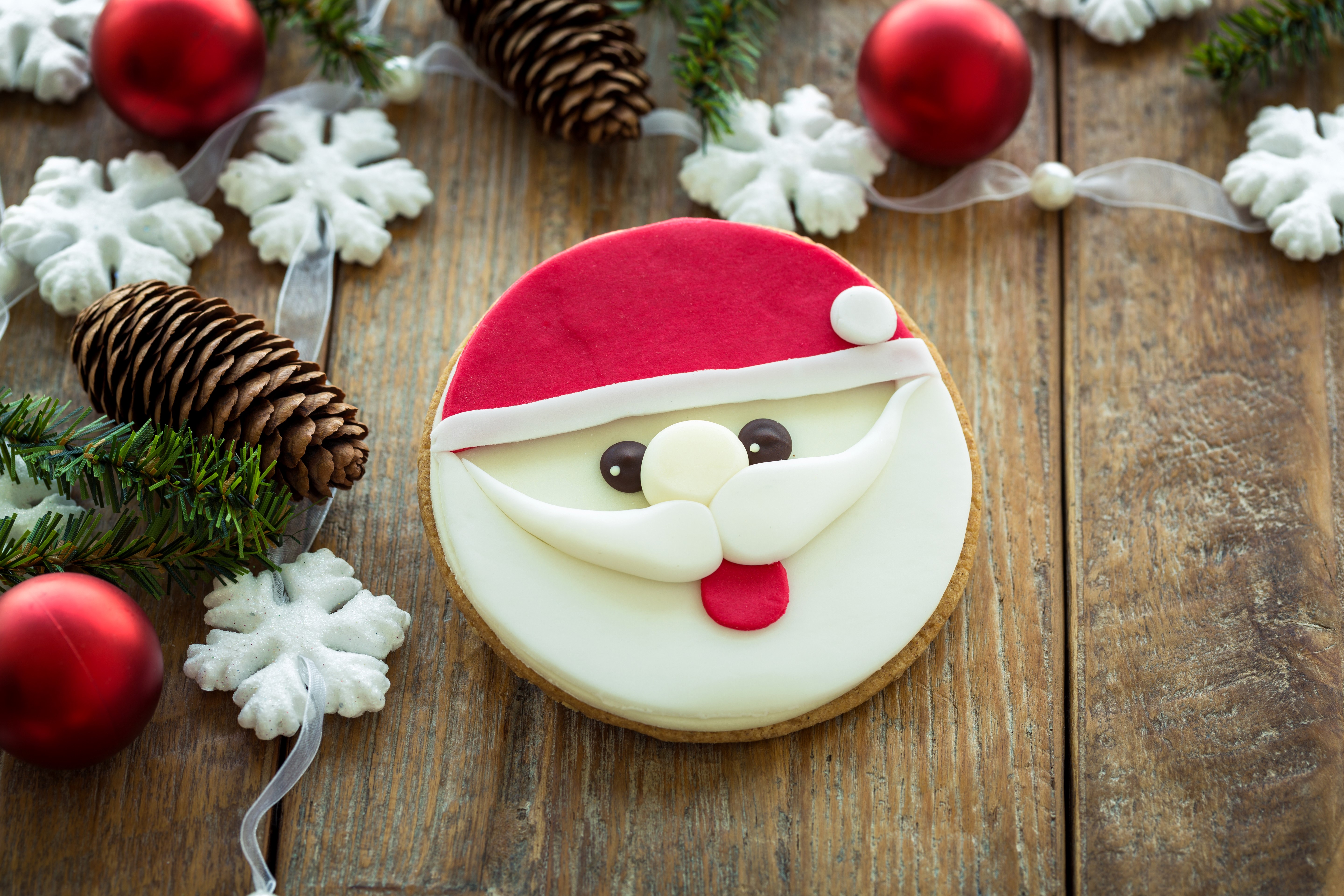 Santa Claus cookie with Christmas decorations on wood HD Wallpaper