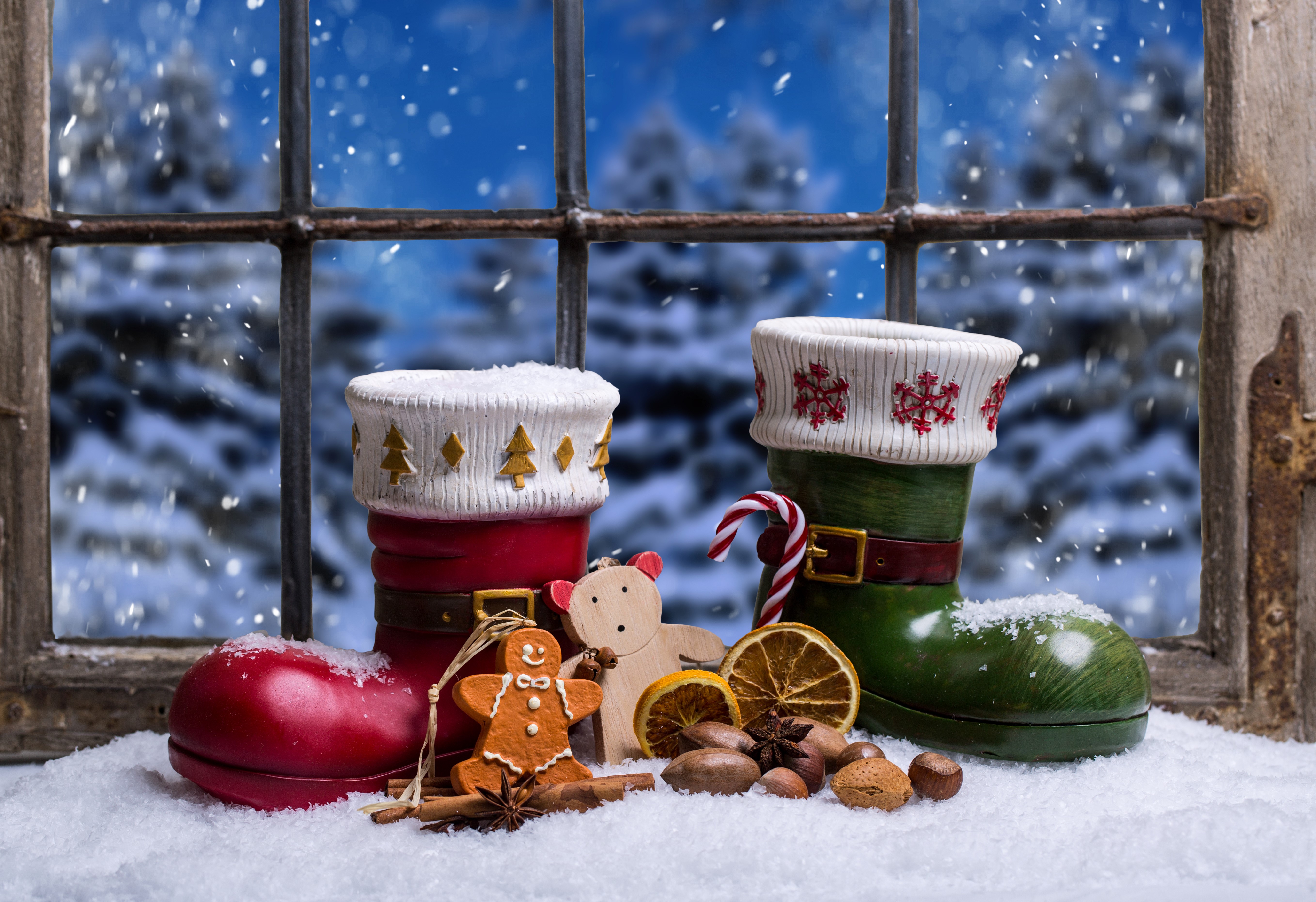 Christmas boots with gingerbread and nuts on a snowy windowsill HD Wallpaper