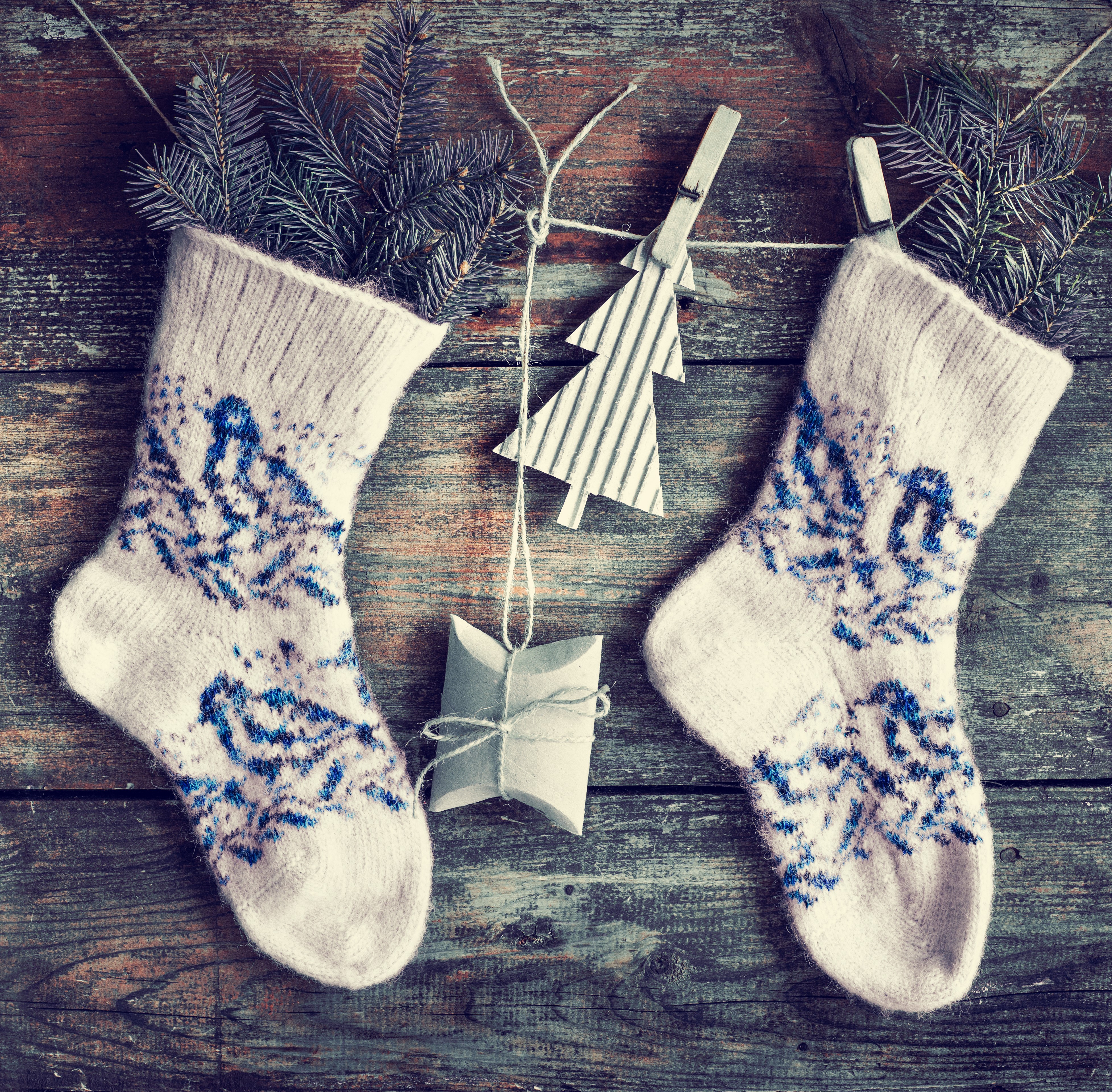 Christmas stockings with pine branches on wood HD Wallpaper