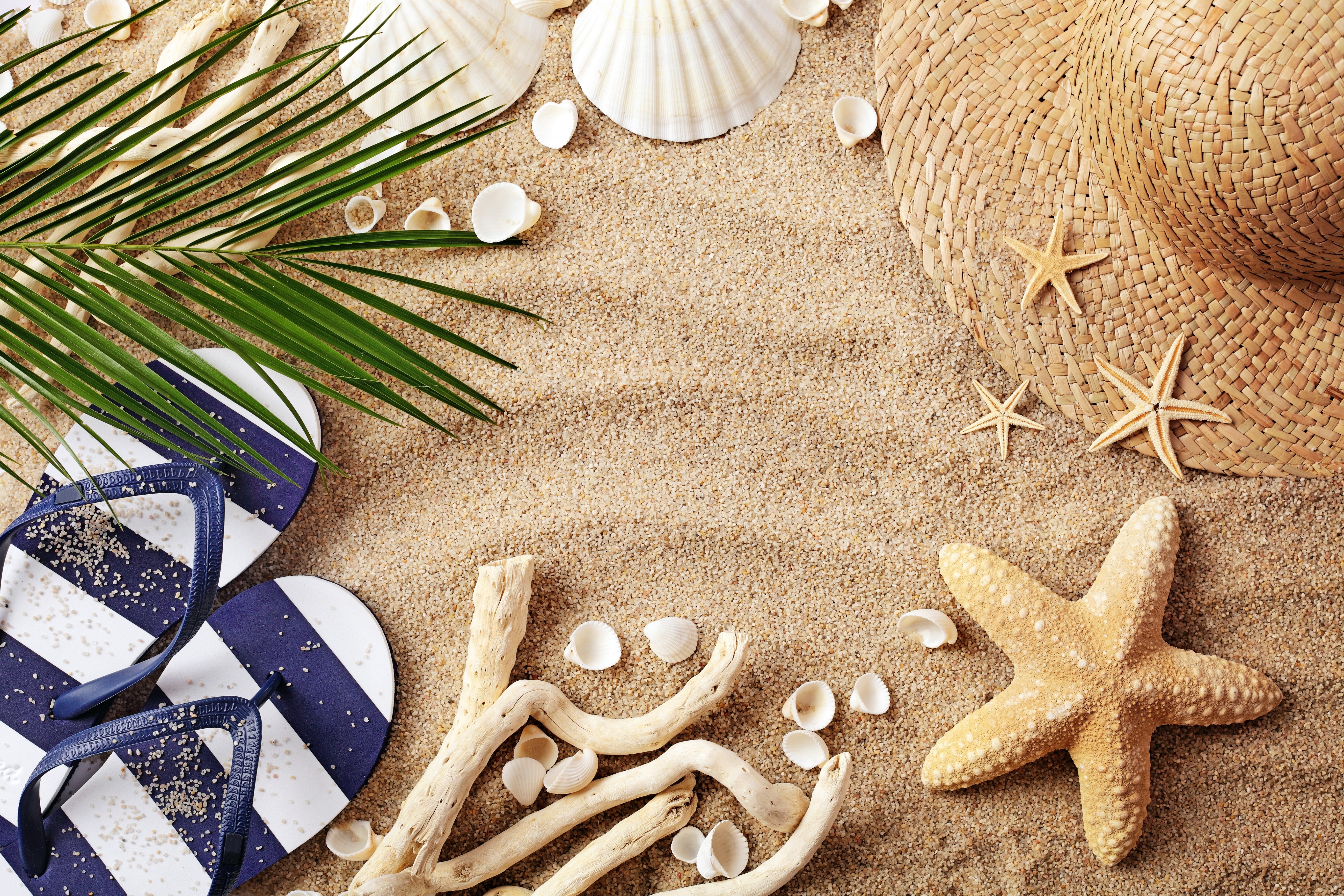 Summer Beach Scene with Hat, Flip-flops, Starfish, and Shells HD Wallpaper