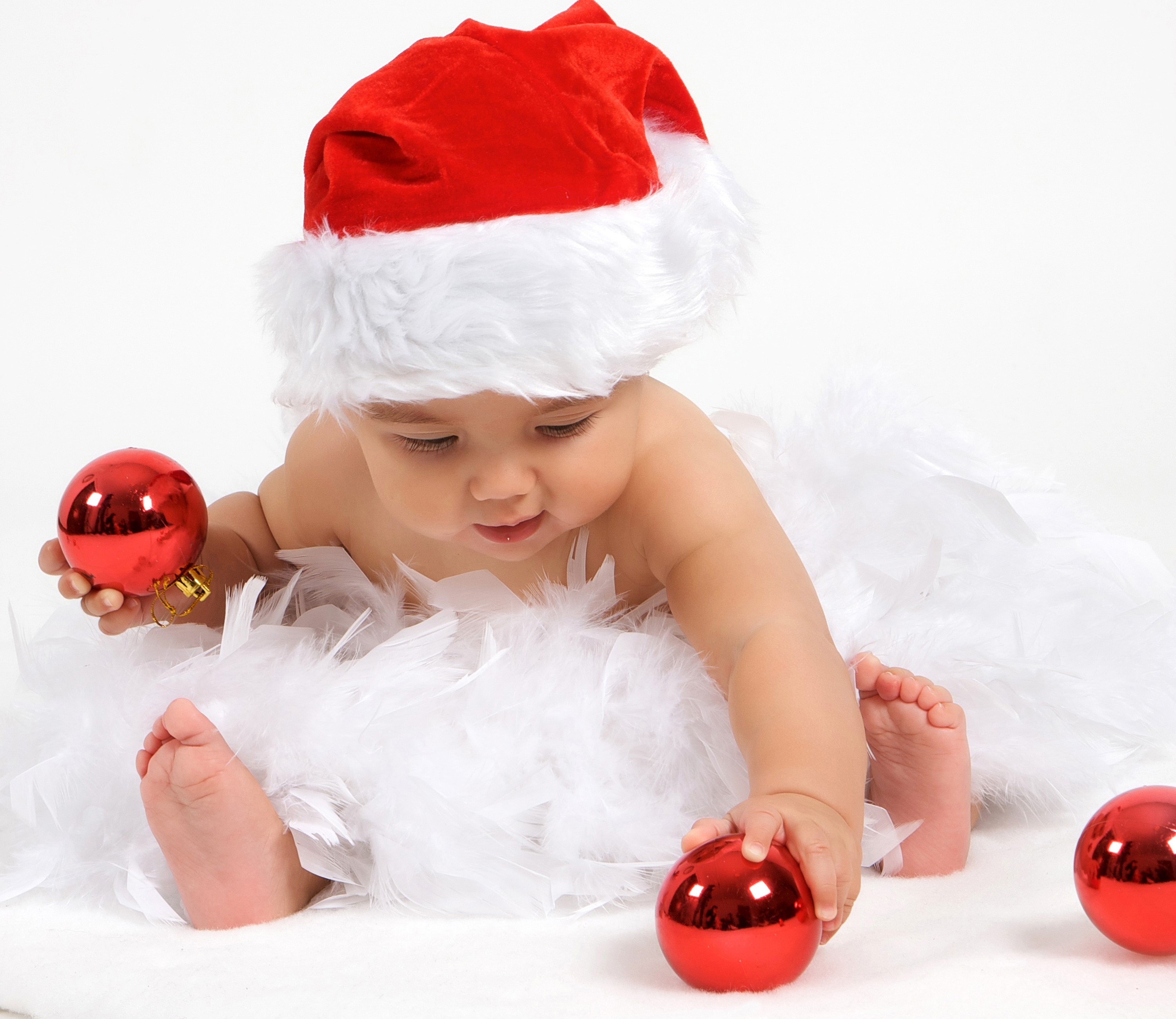 Baby in Santa hat with Christmas ornaments HD Wallpaper
