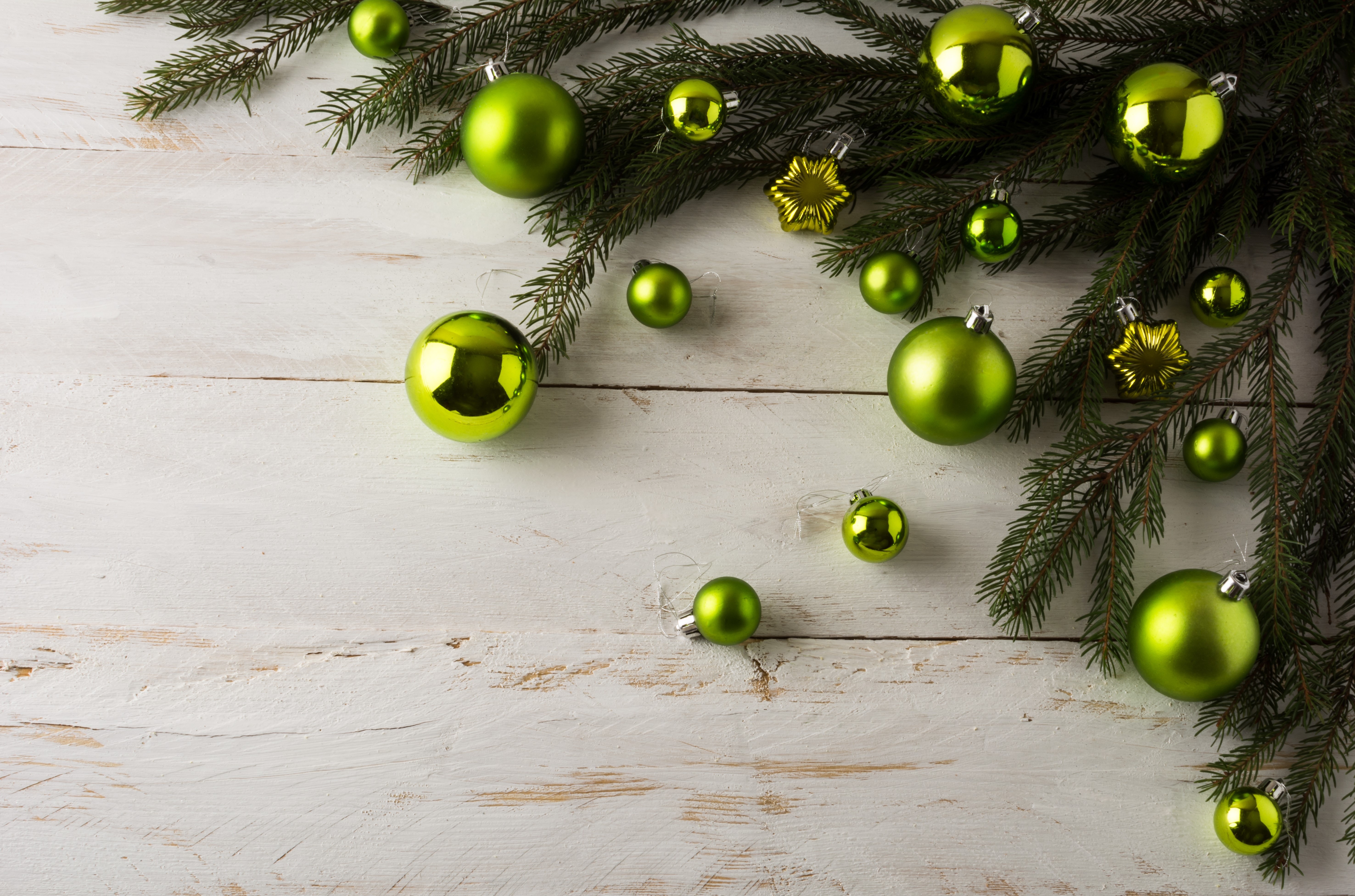 Christmas ornaments on fir branches on wood planks HD Wallpaper