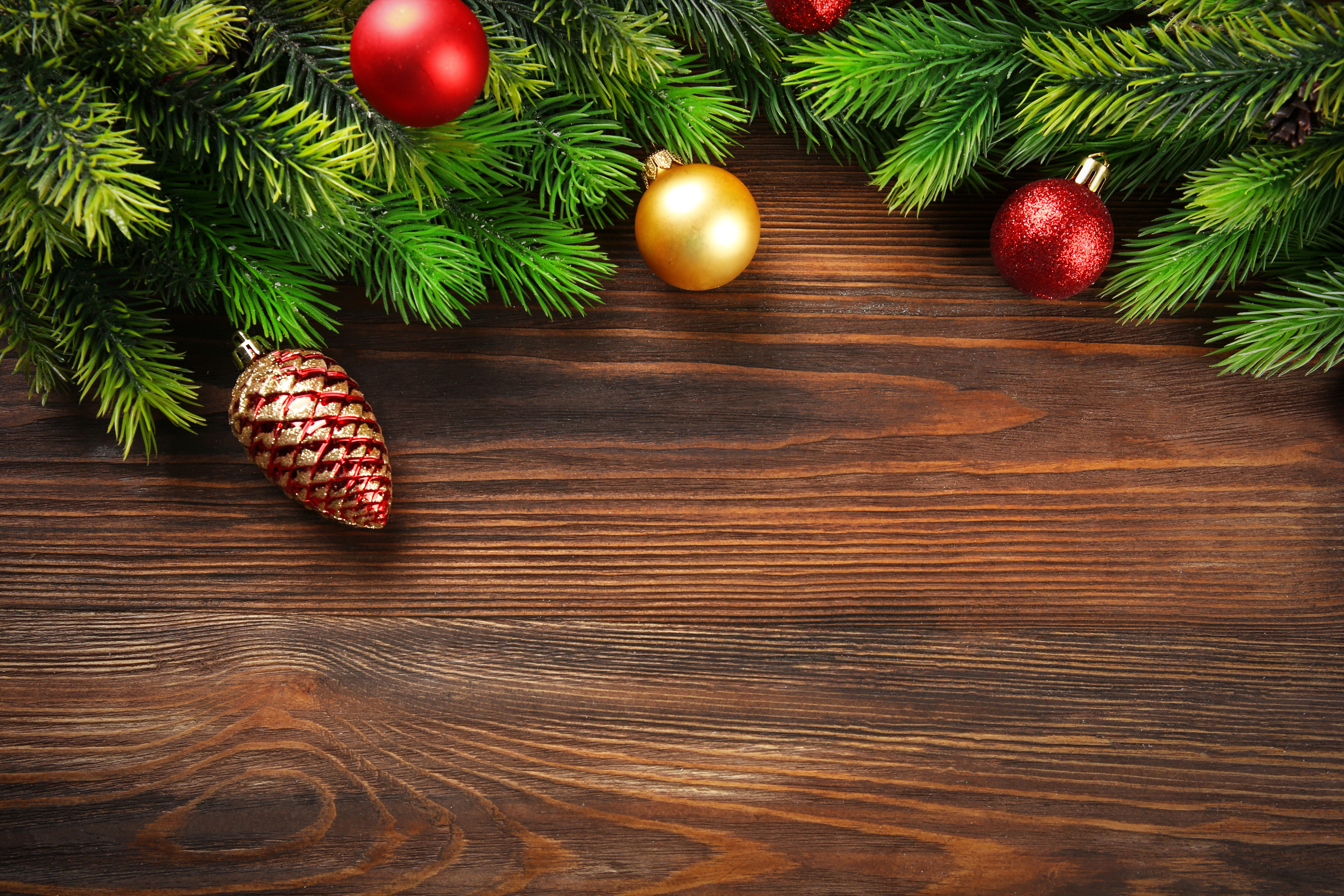 4K Christmas Pine Branches and Ornaments on Wood HD Wallpaper