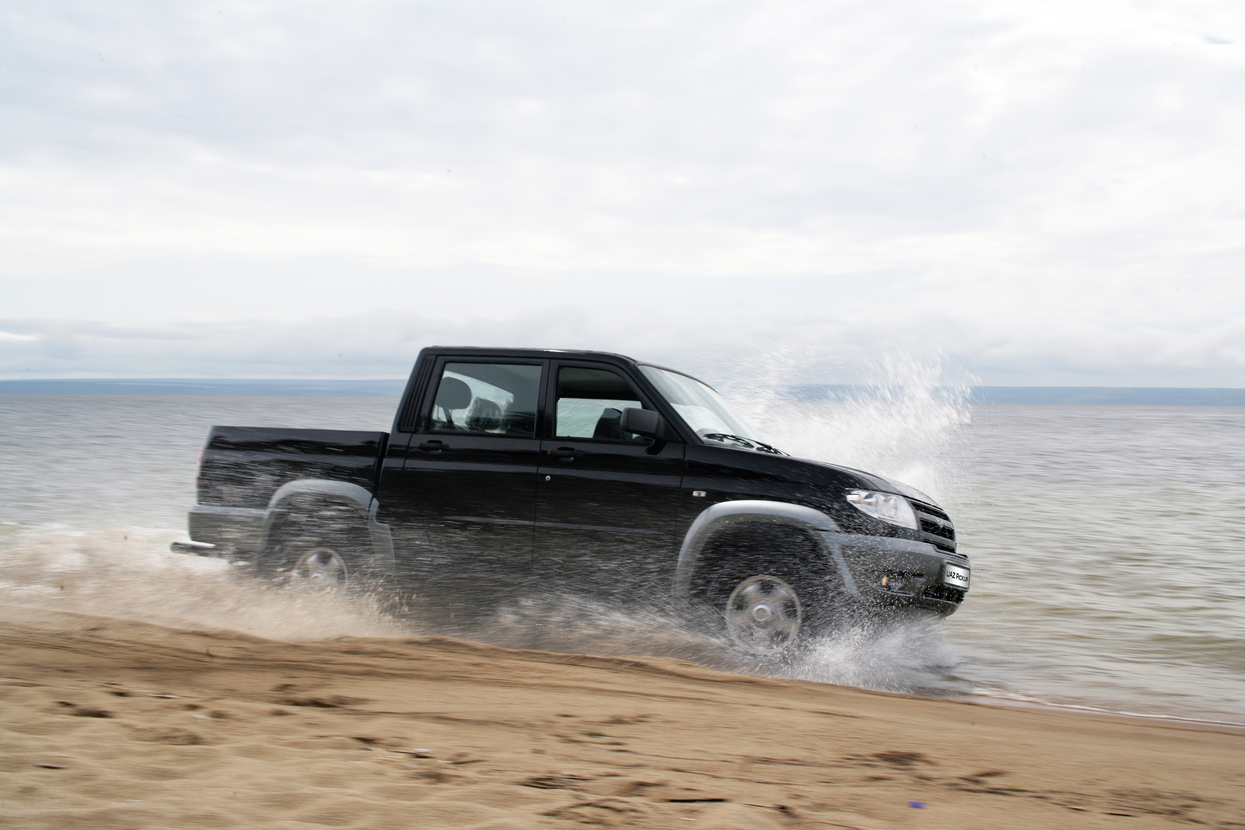 Black UAZ Patriot Off-Road 4x4 Driving on a Beach HD Wallpaper