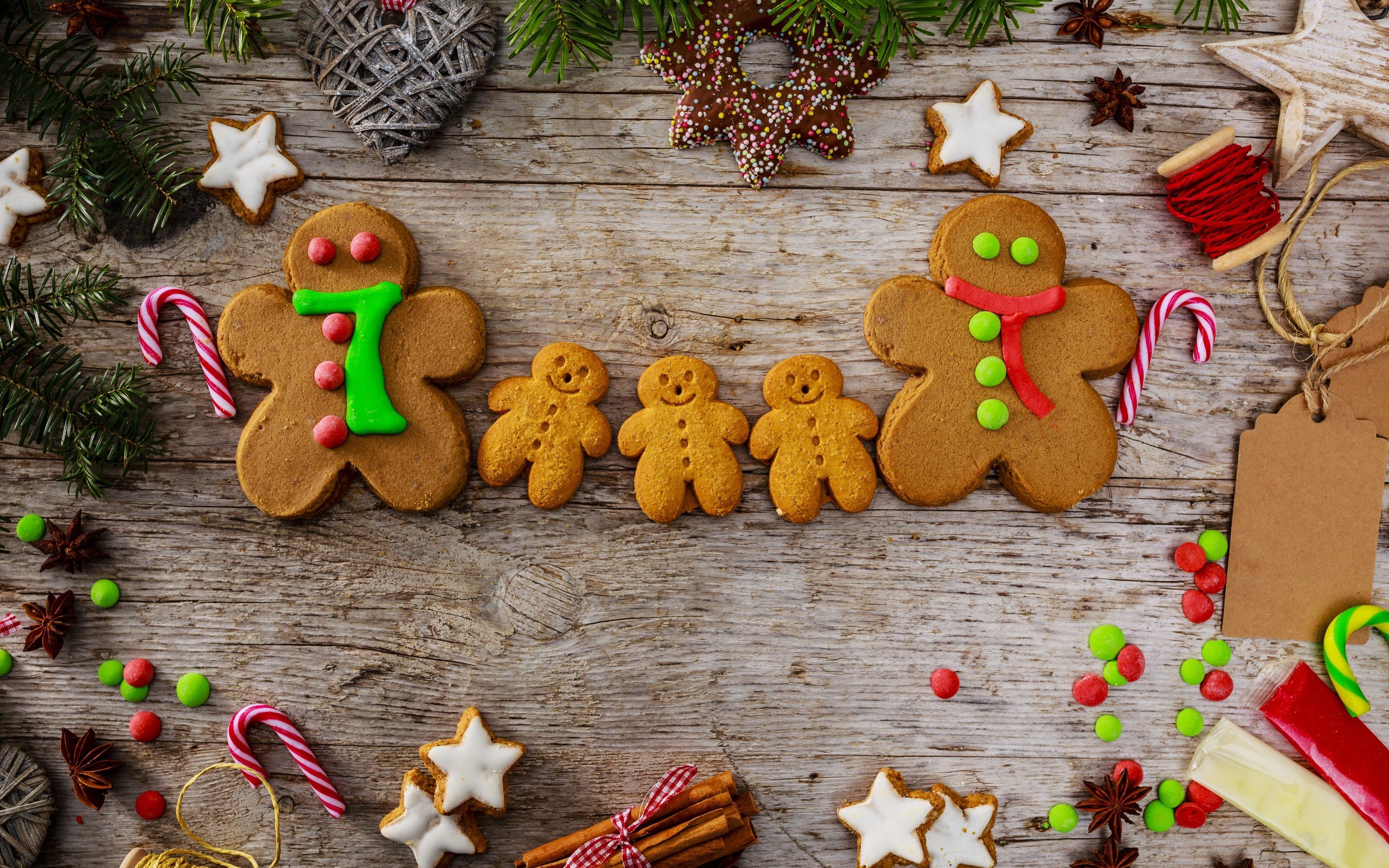 Christmas gingerbread cookies and decorations on wooden table HD Wallpaper