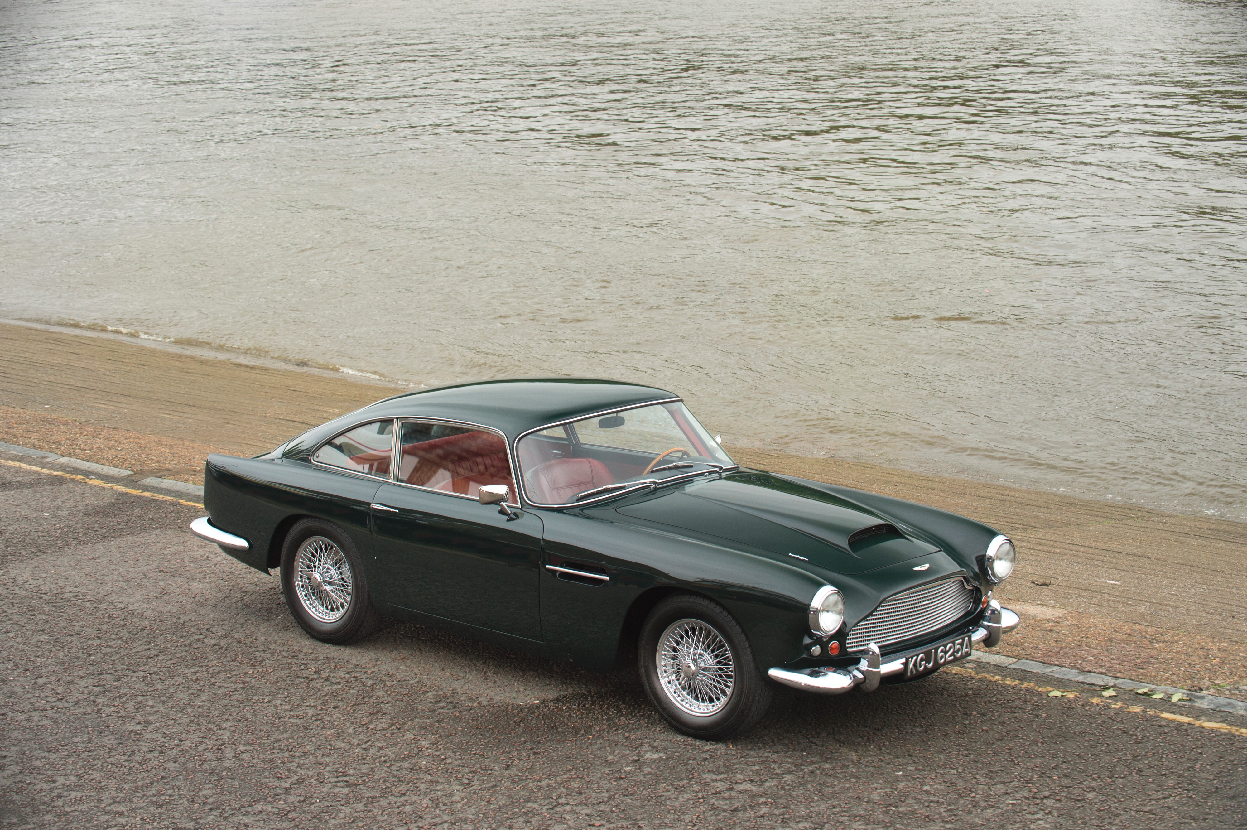 Green Aston Martin DB4 Series II by the water HD Wallpaper