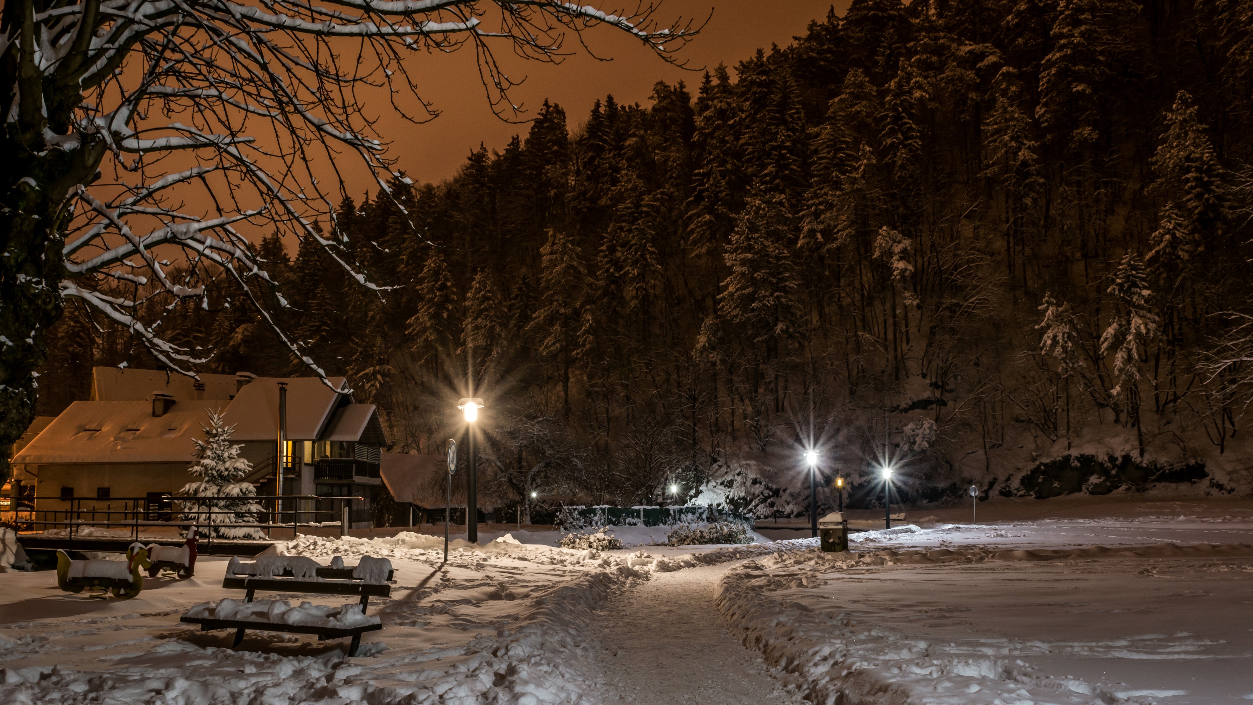 Winter night in Samobor, Croatia with snow and street lights HD Wallpaper