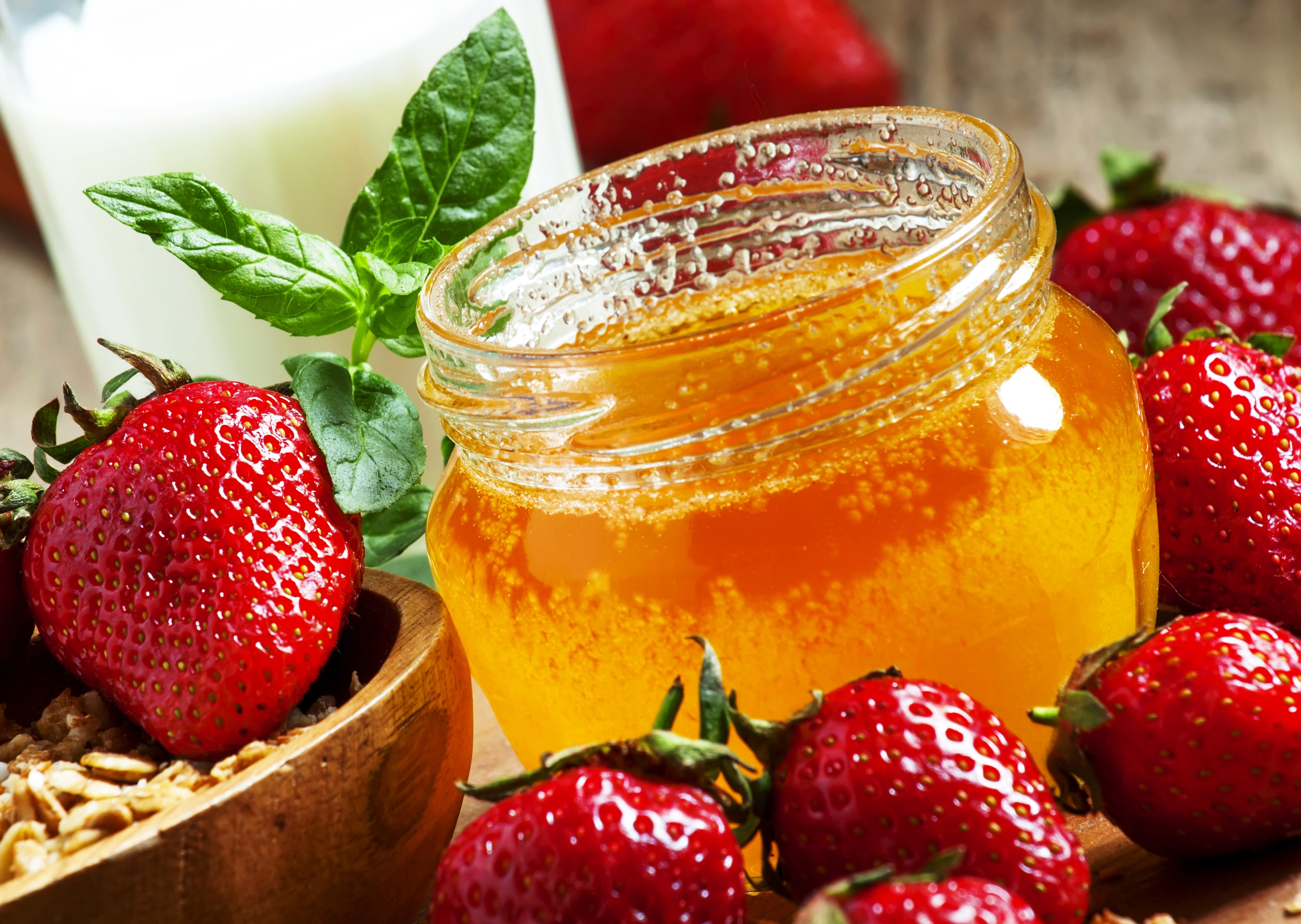 Honey jar with strawberries and milk HD Wallpaper