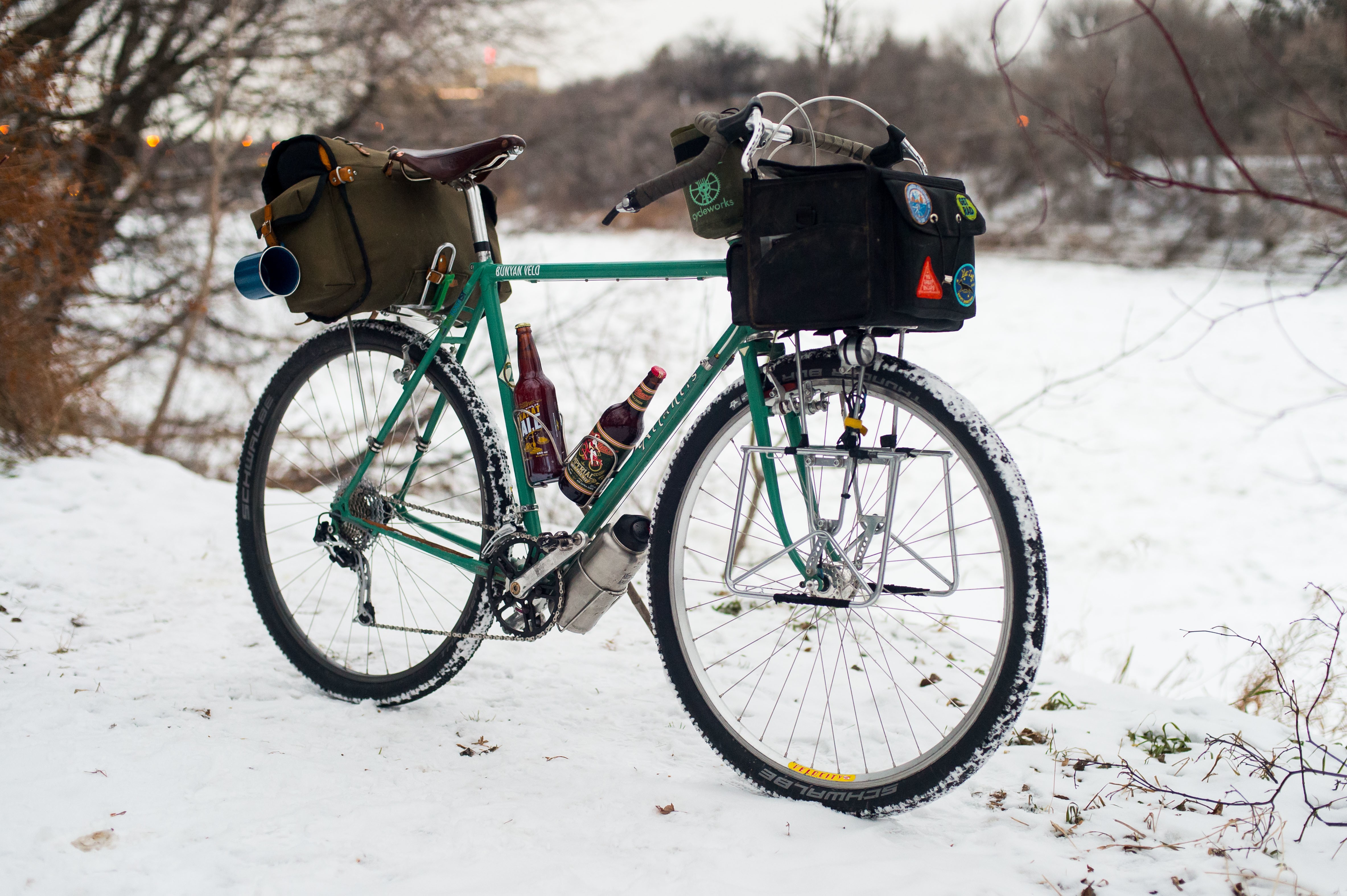 Bicycle with beer bottles in the snow HD Wallpaper