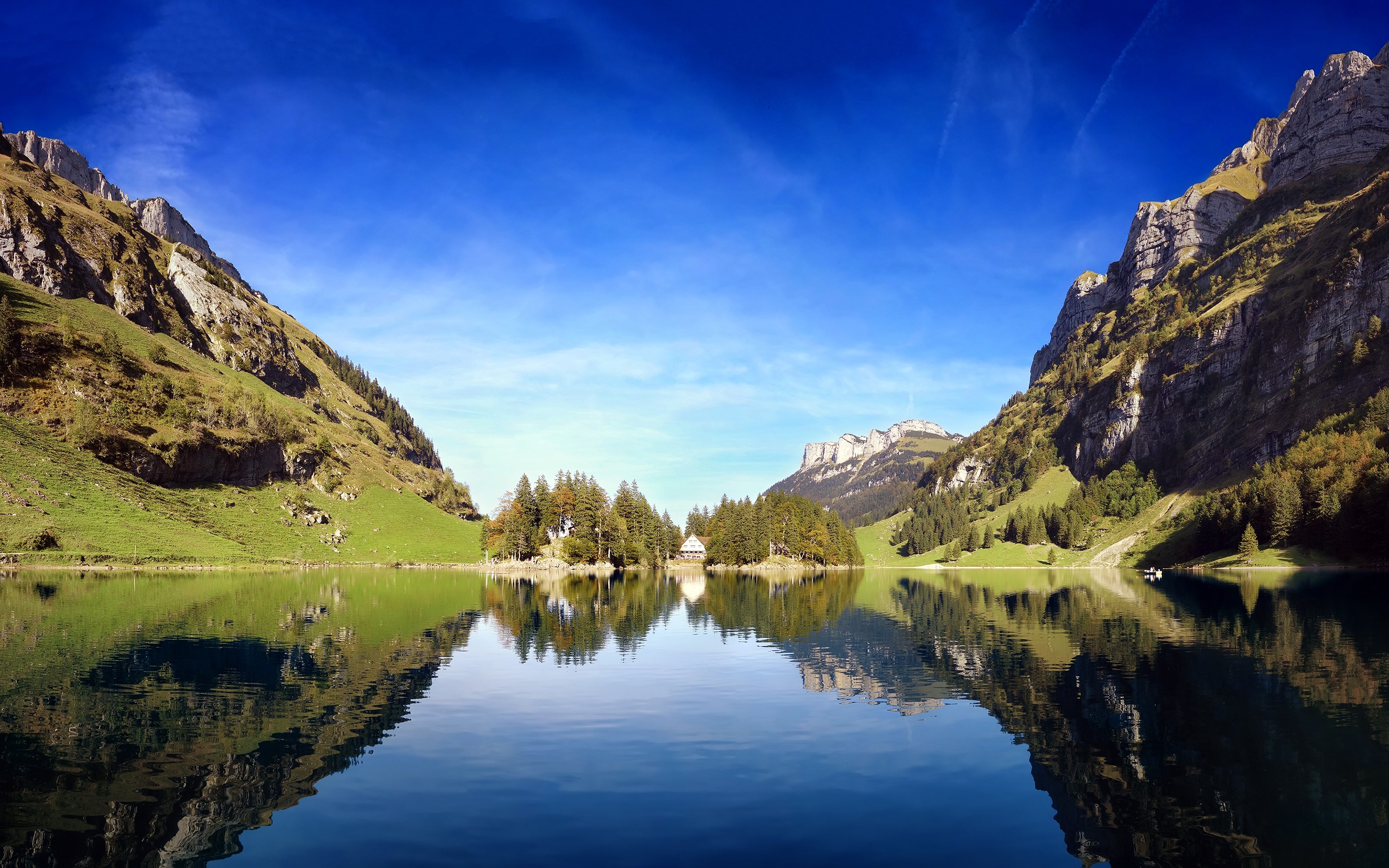 Mountain lake with reflection and a small house on an island HD Wallpaper