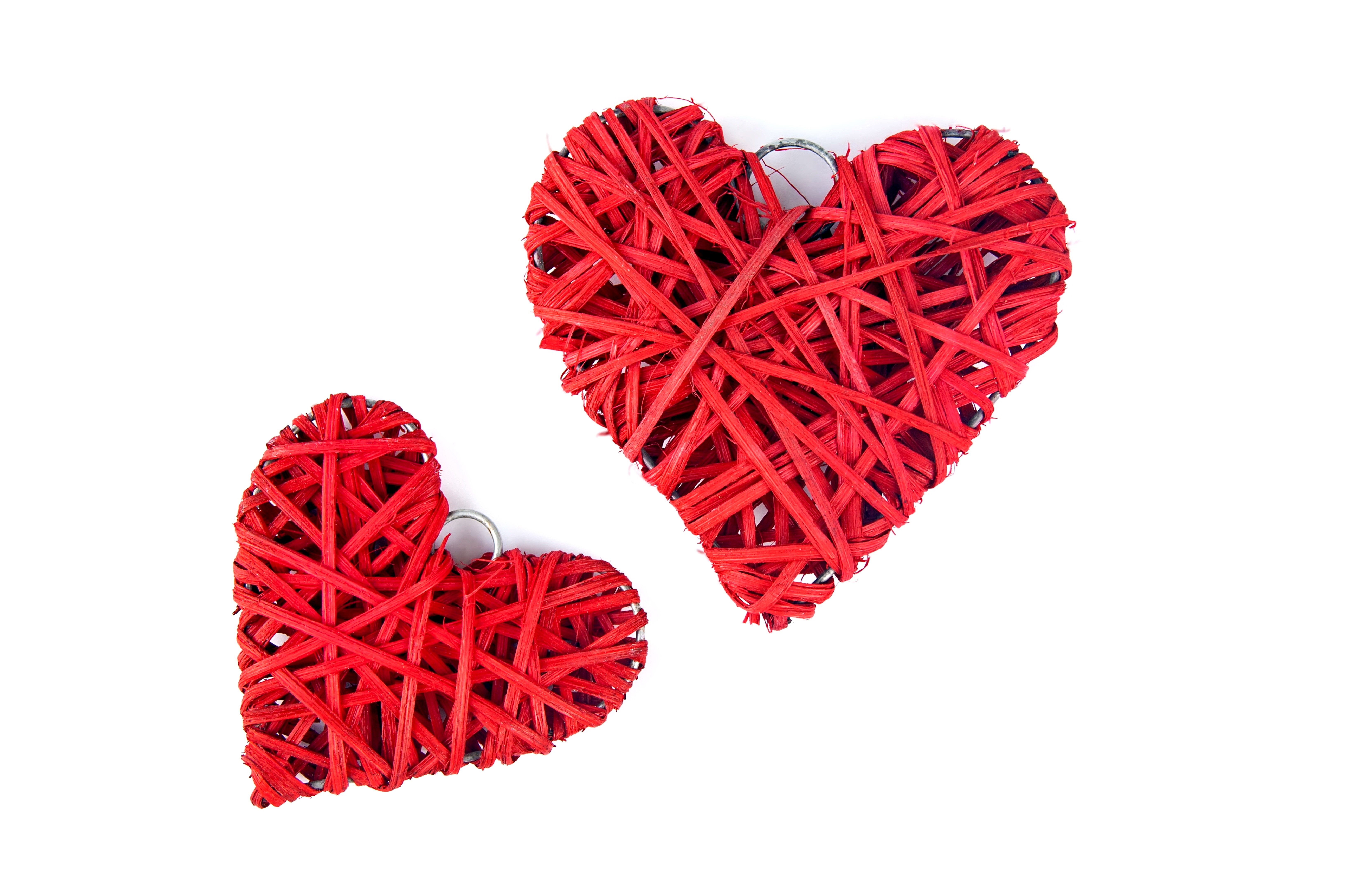 Two red woven hearts on white background HD Wallpaper