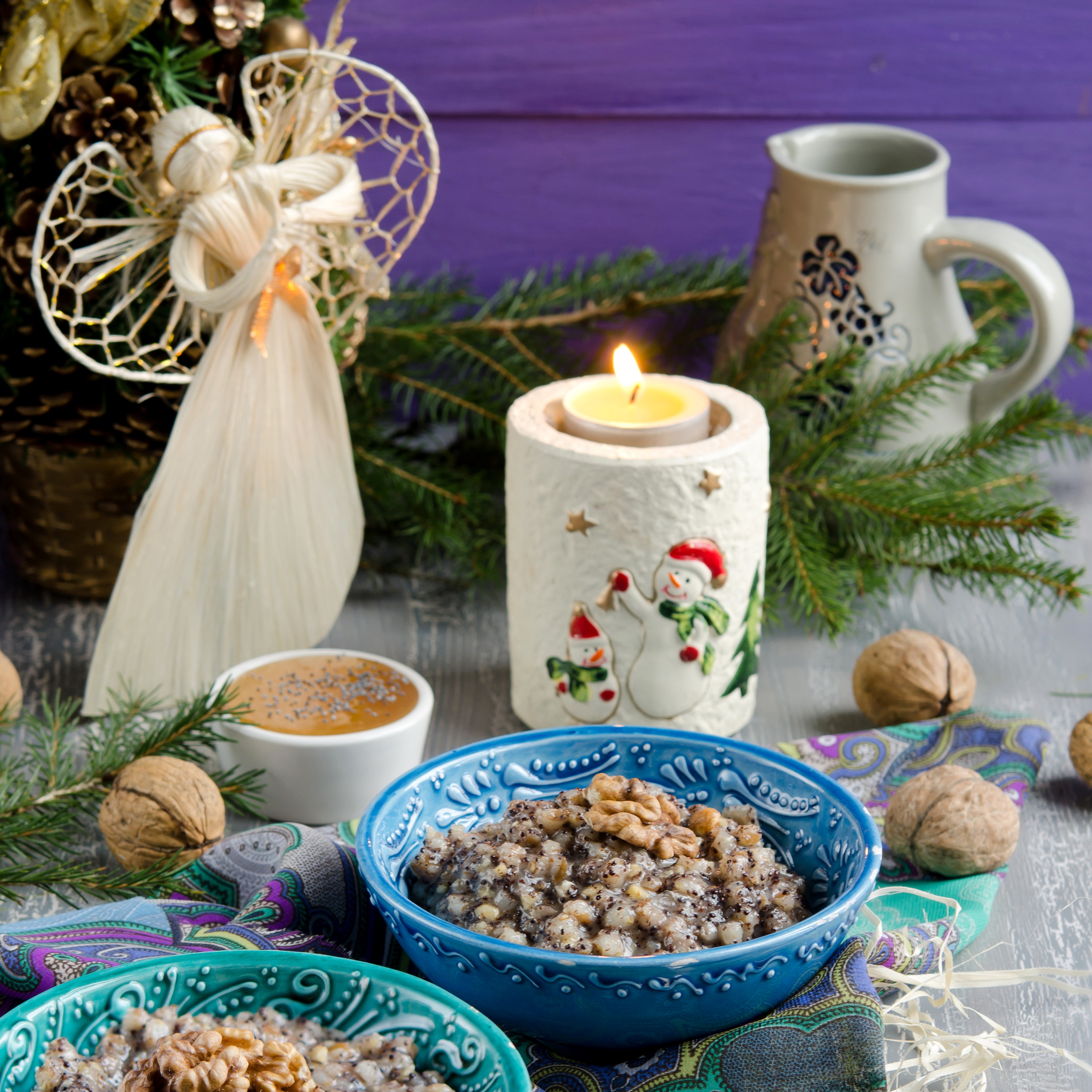 Christmas porridge with nuts and candle HD Wallpaper