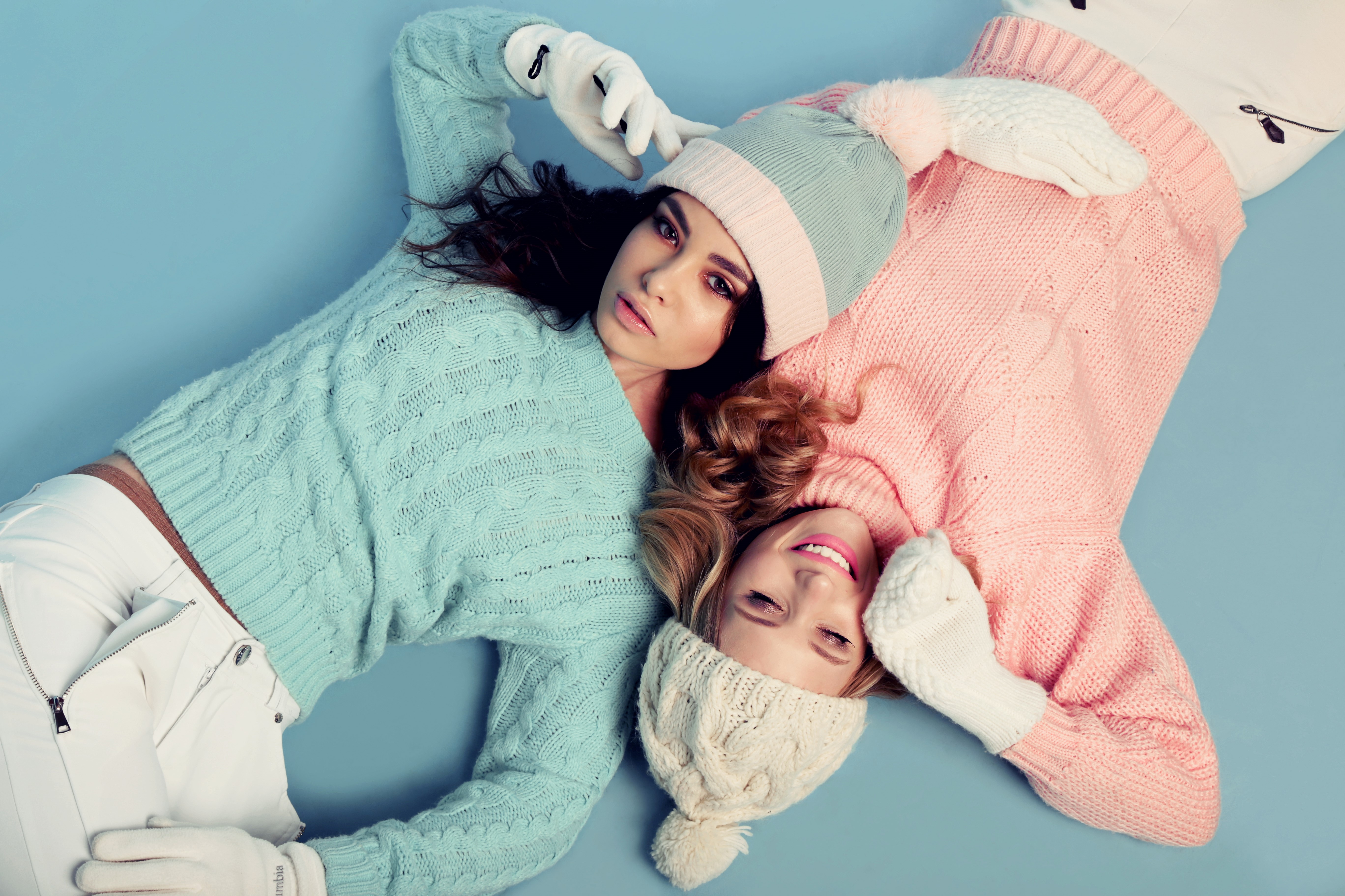 Two women in winter hats and sweaters HD Wallpaper