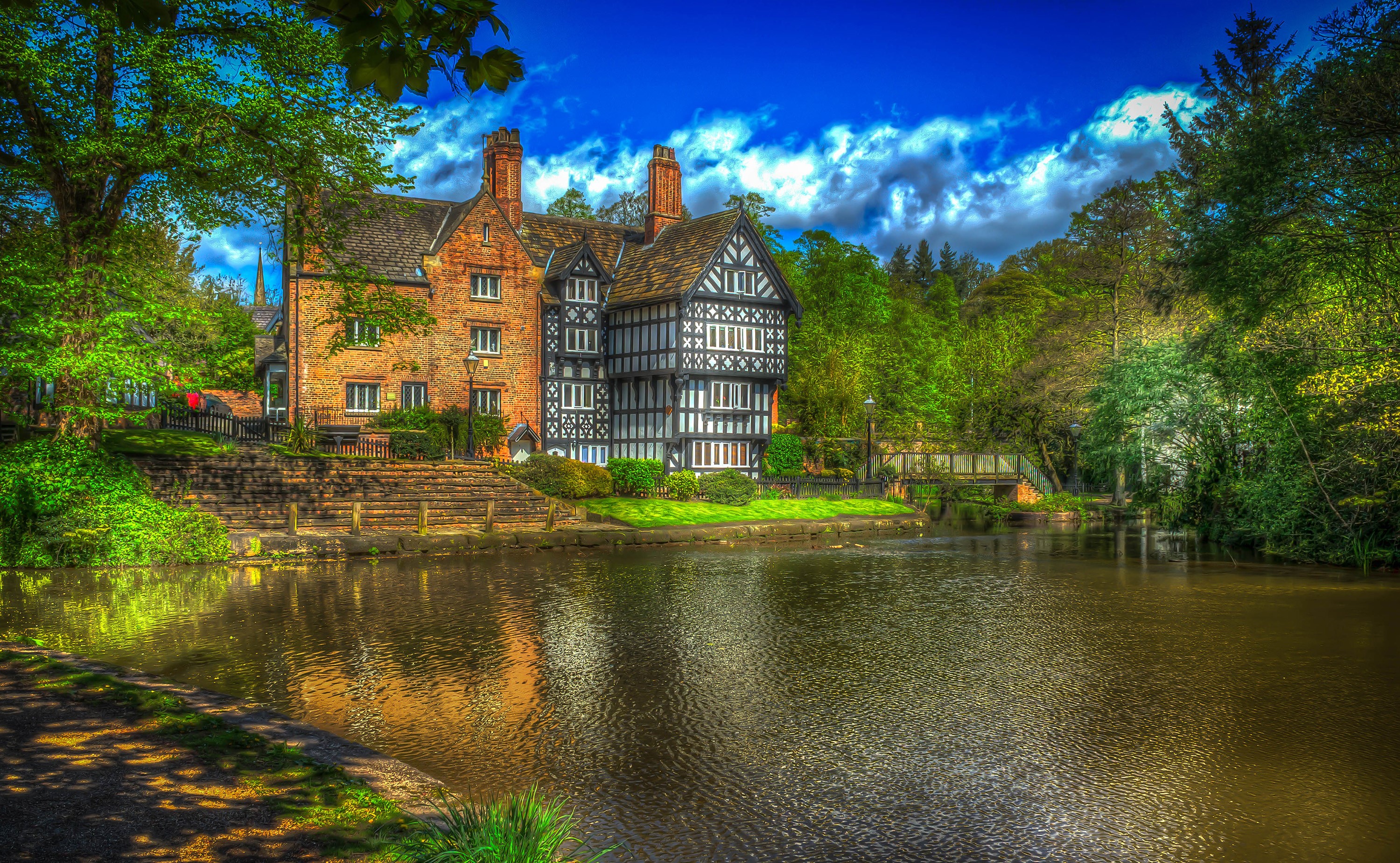 Tudor style house by a river in Salford, Greater Manchester, UK HD Wallpaper