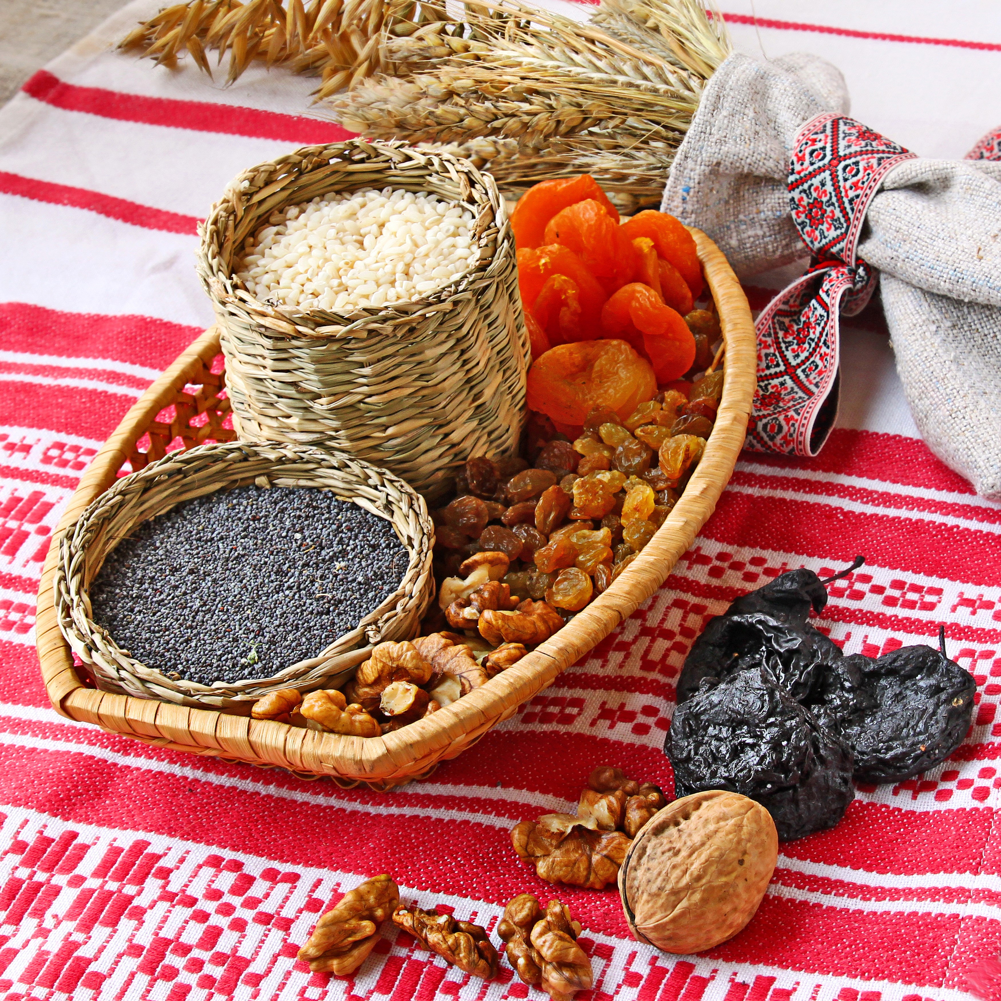 Still life of grains, nuts, and dried fruits on a red and white cloth HD Wallpaper