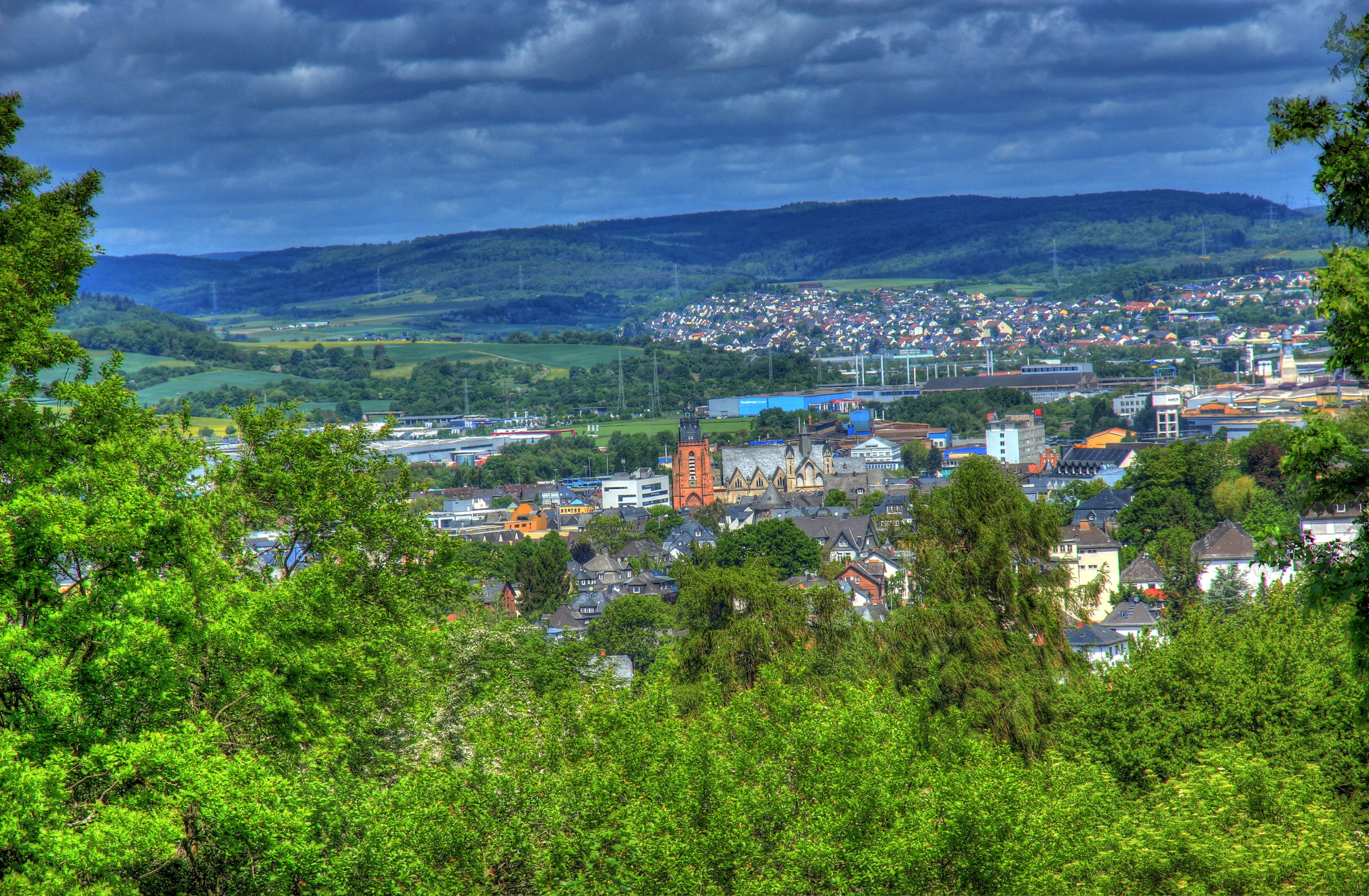 View of Wetzlar, Germany with rolling hills and clouds HD Wallpaper