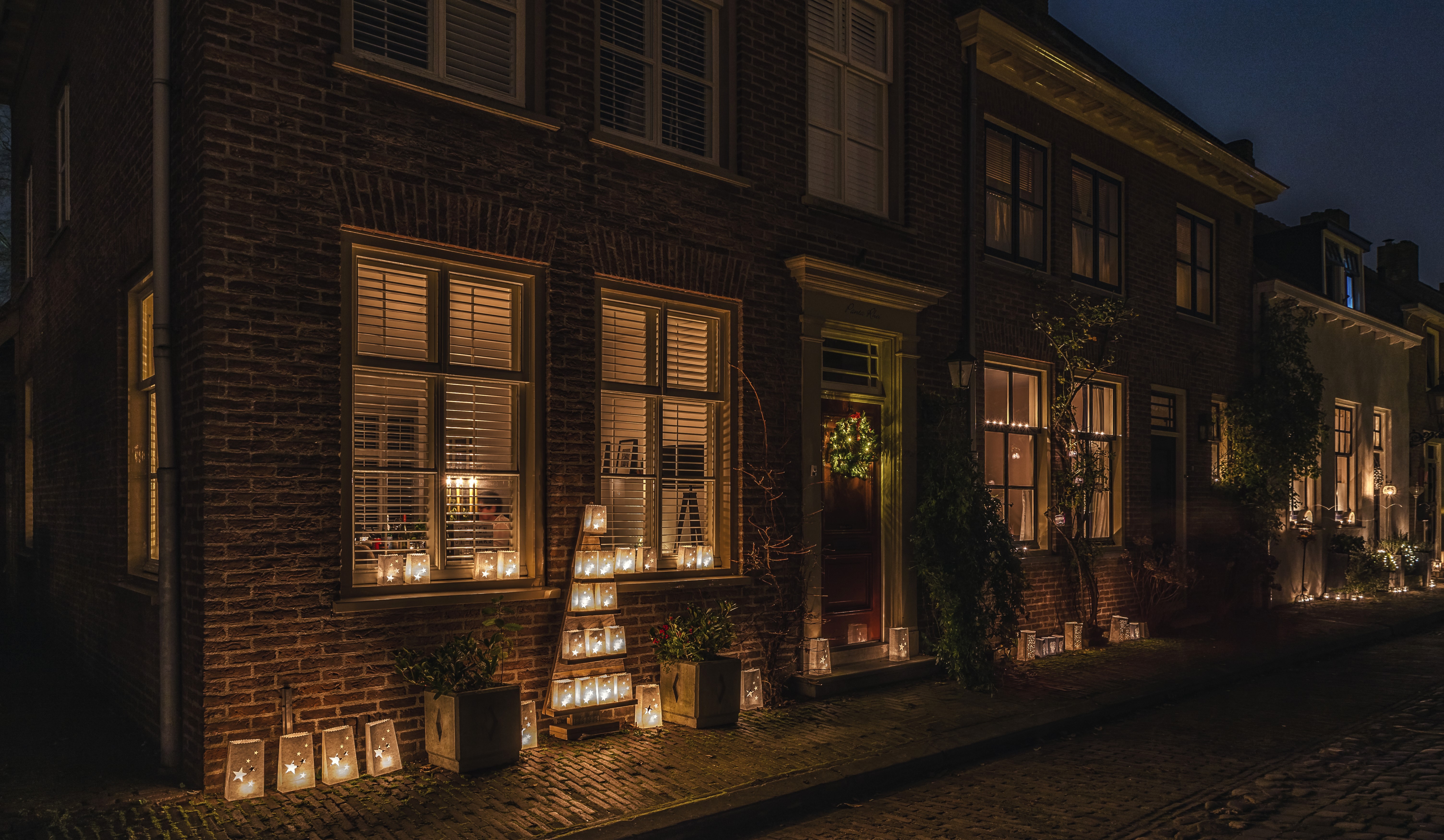 Christmas lanterns on a street in Buren, Netherlands at night HD Wallpaper