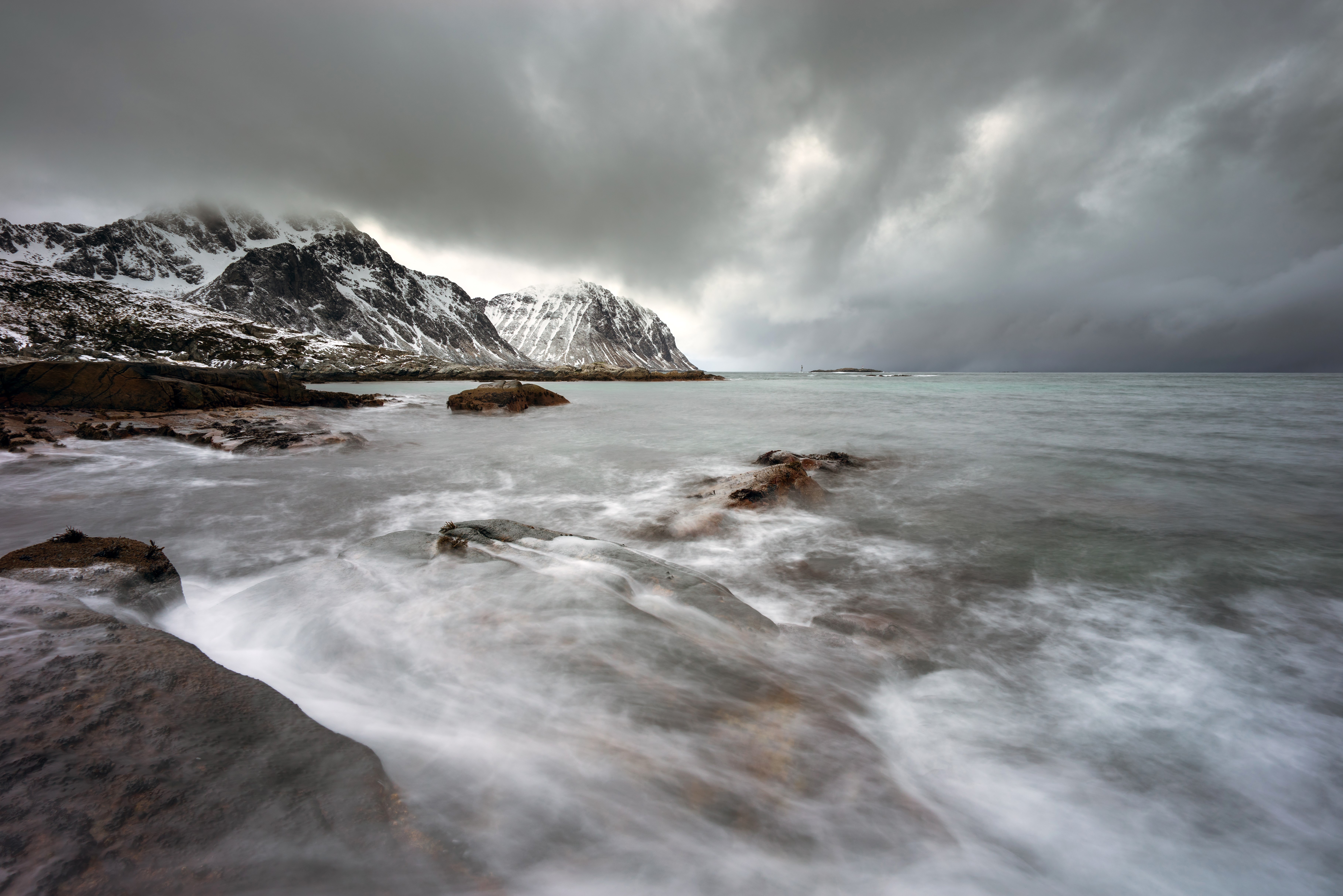 Winter Coastline with Snow-Capped Mountains and Waves in Lofoten, Norway HD Wallpaper