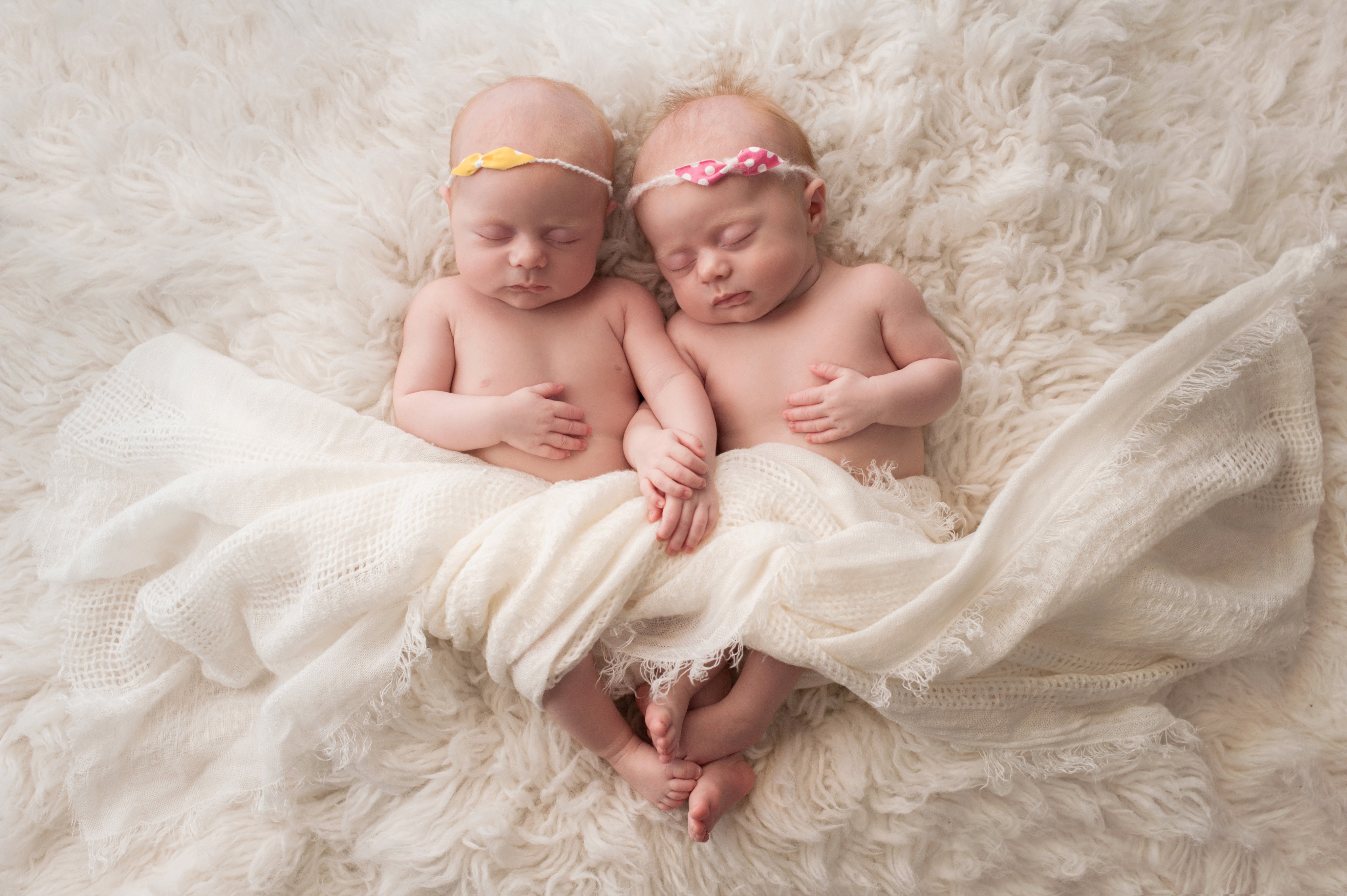 Two Sleeping Infants Holding Hands HD Wallpaper