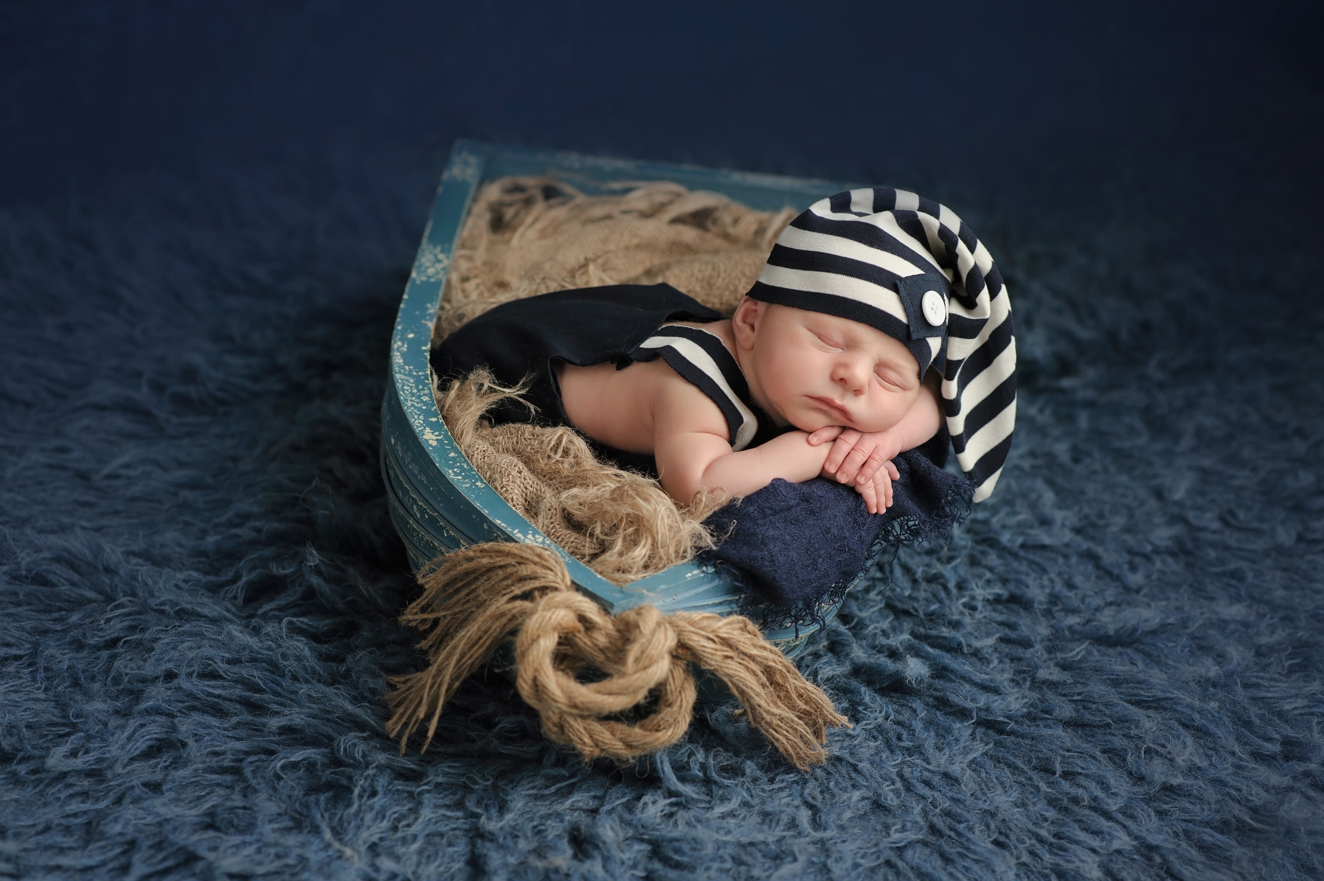 Newborn baby sleeping in a boat prop HD Wallpaper