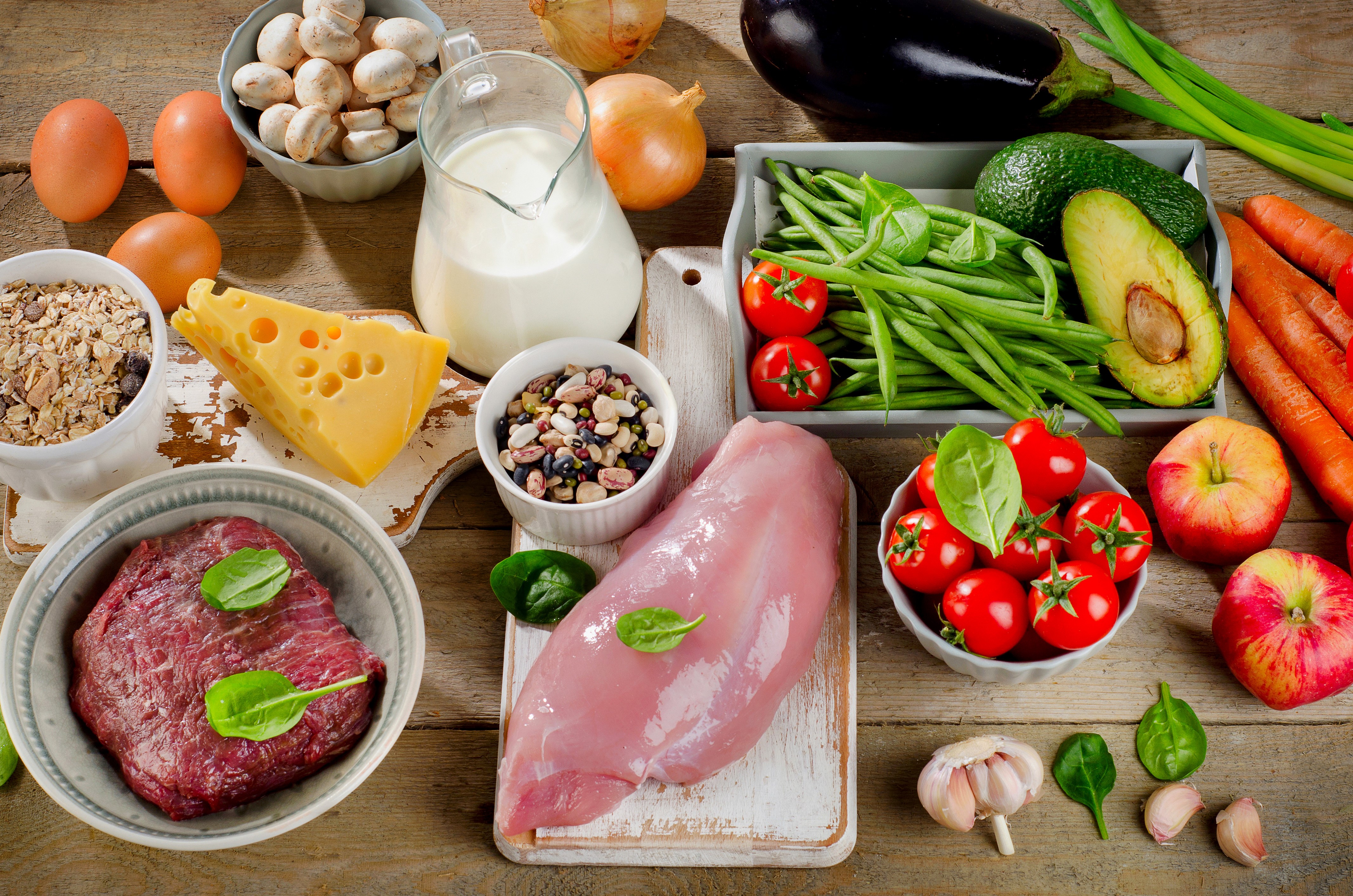 Assortment of Foods Including Meat, Cheese, Milk, Eggs, and Vegetables HD Wallpaper