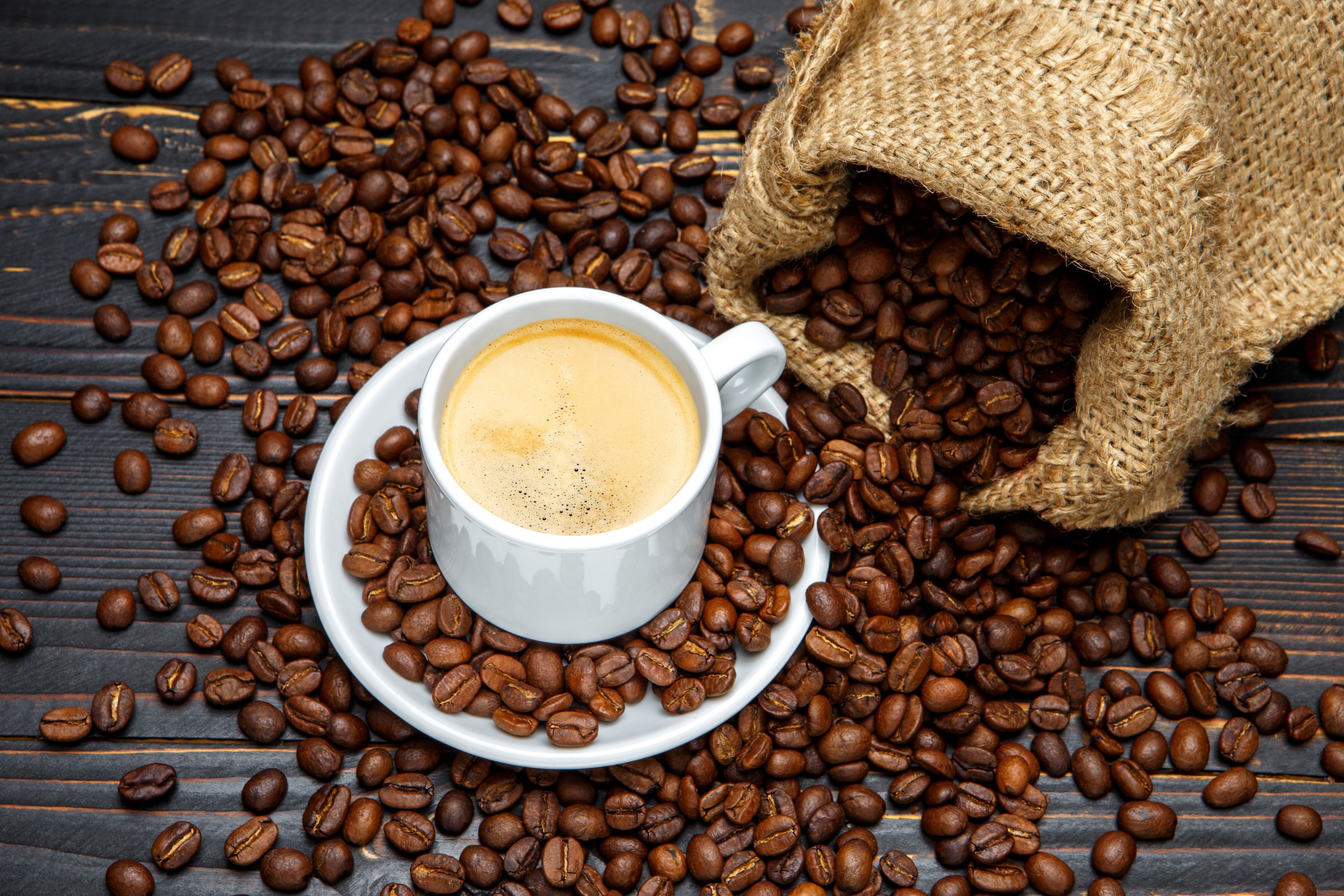 Coffee beans and cup of coffee HD Wallpaper