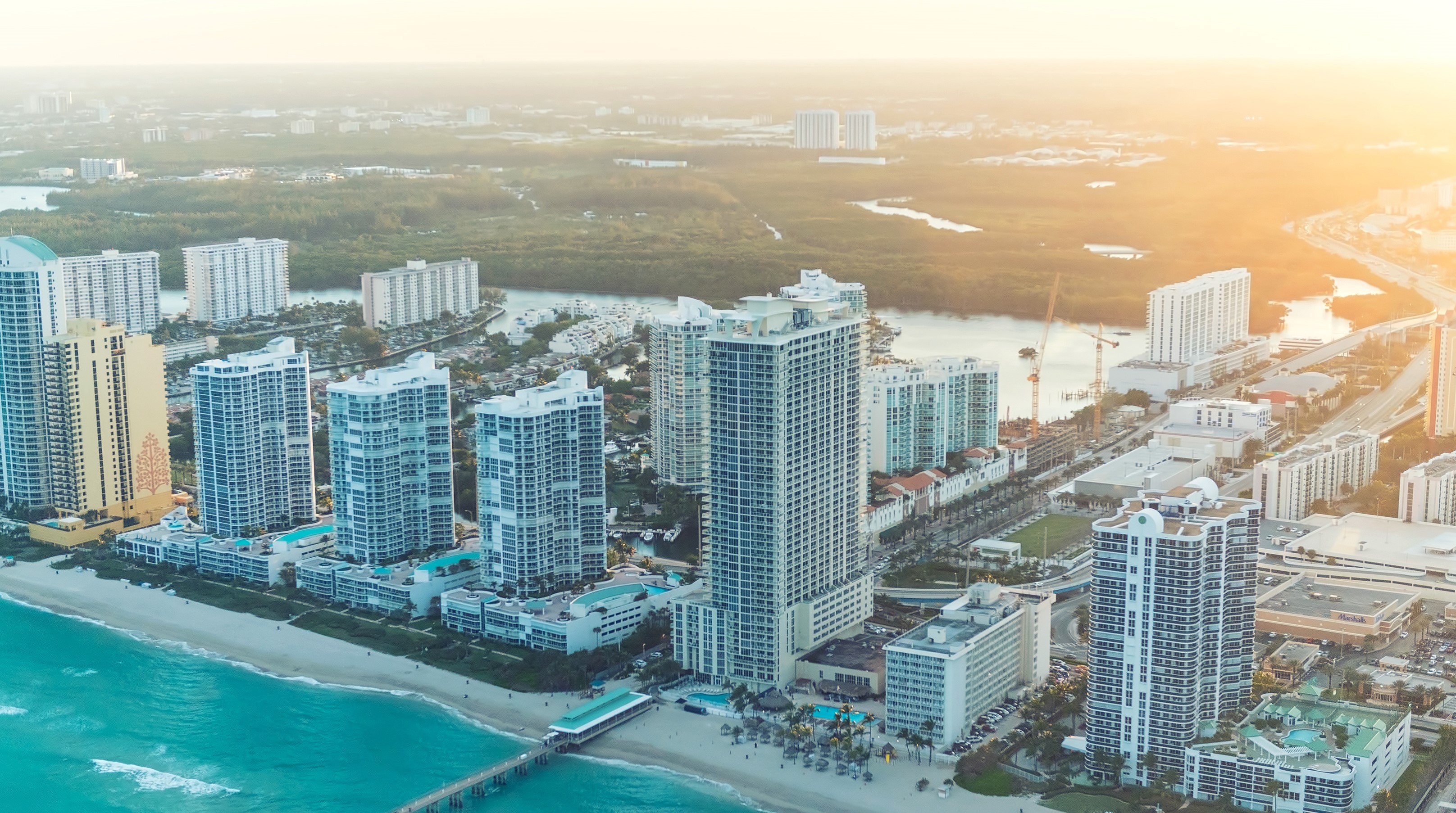 Aerial view of Miami coastline with high-rise buildings HD Wallpaper