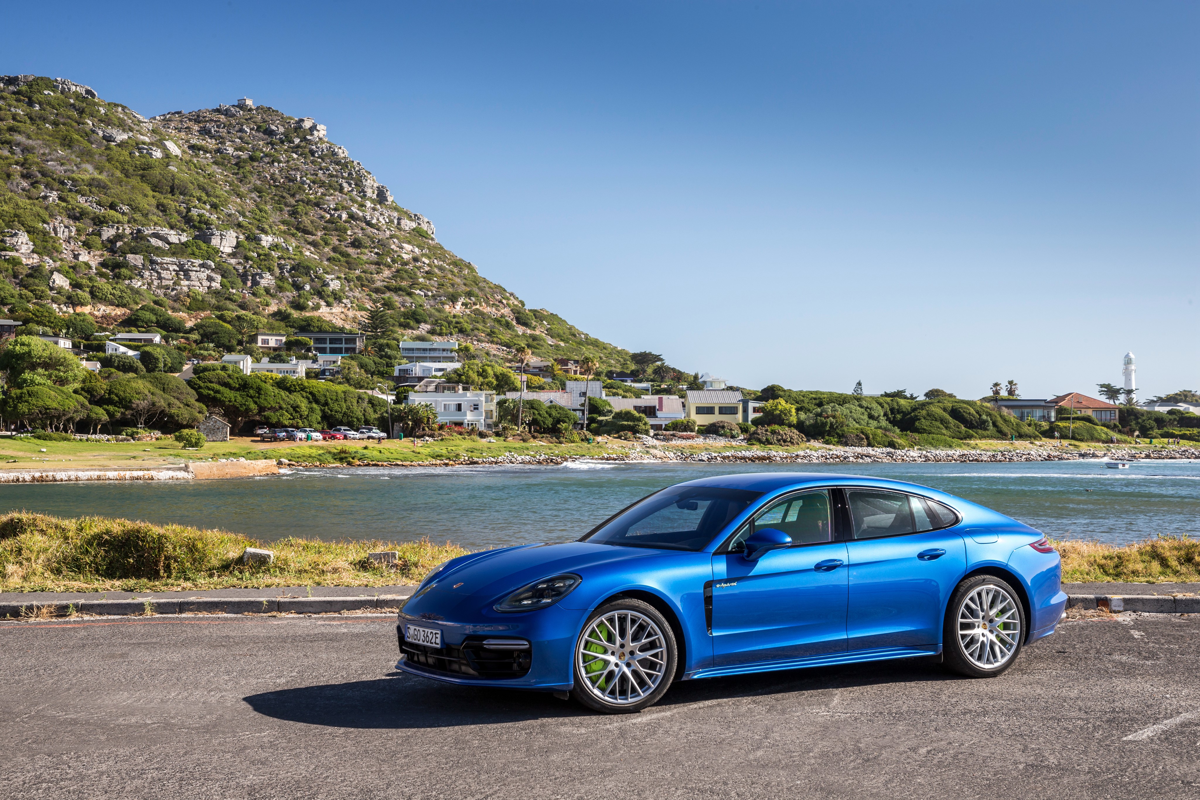Blue Porsche Panamera 4 E-Hybrid parked by the sea HD Wallpaper
