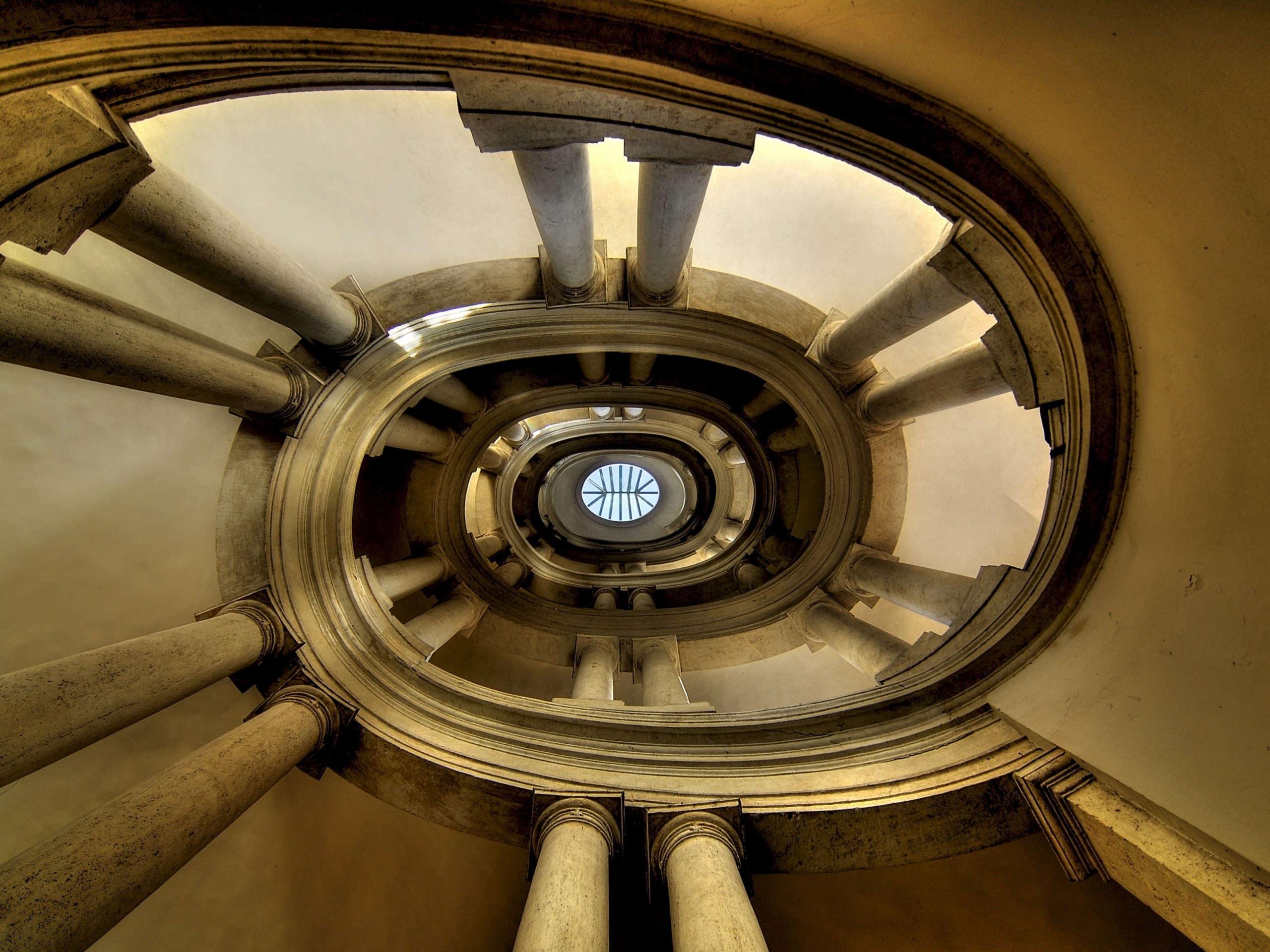 Spiral staircase with columns and skylight HD Wallpaper