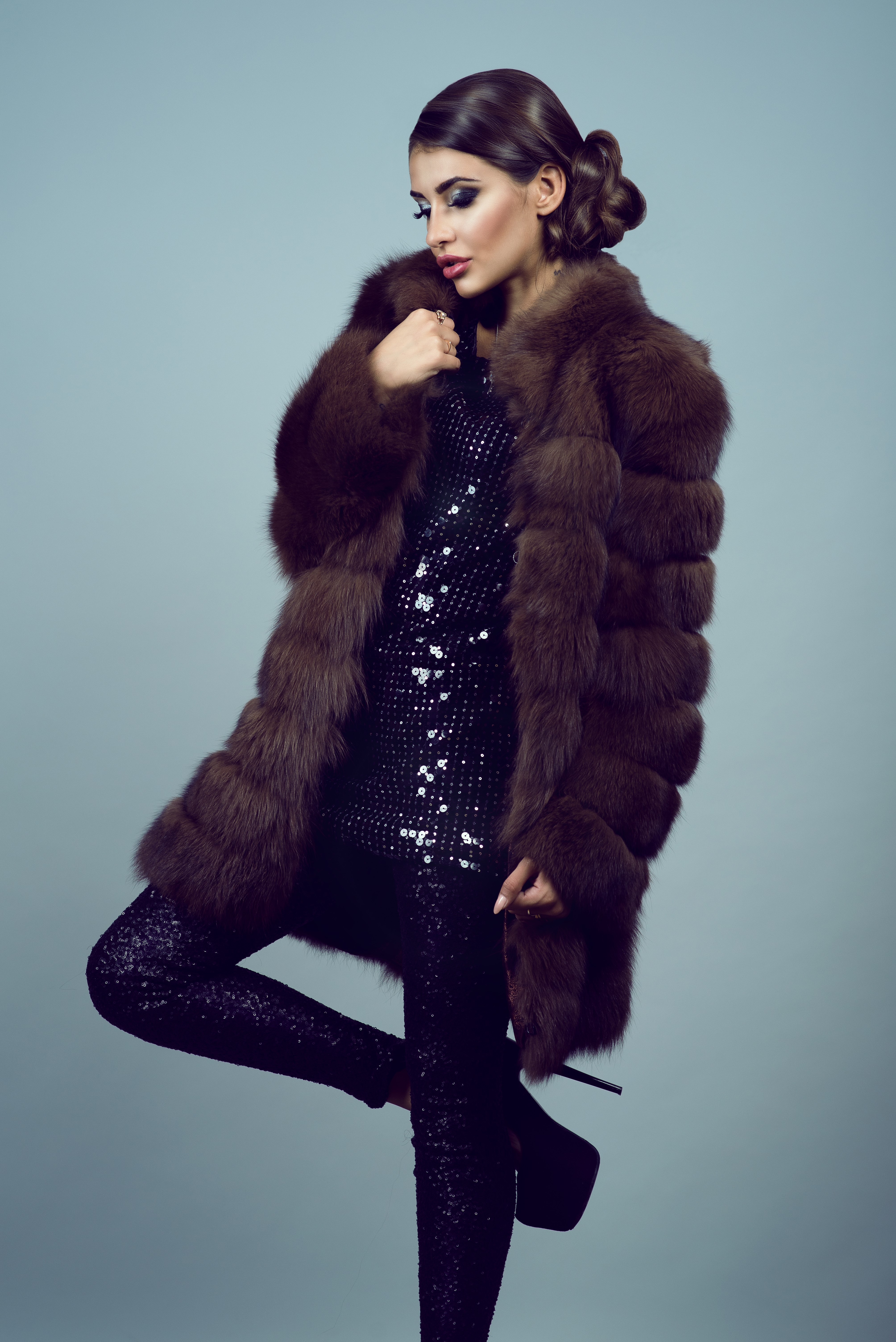 Woman in fur coat and sequin outfit HD Phone Wallpaper