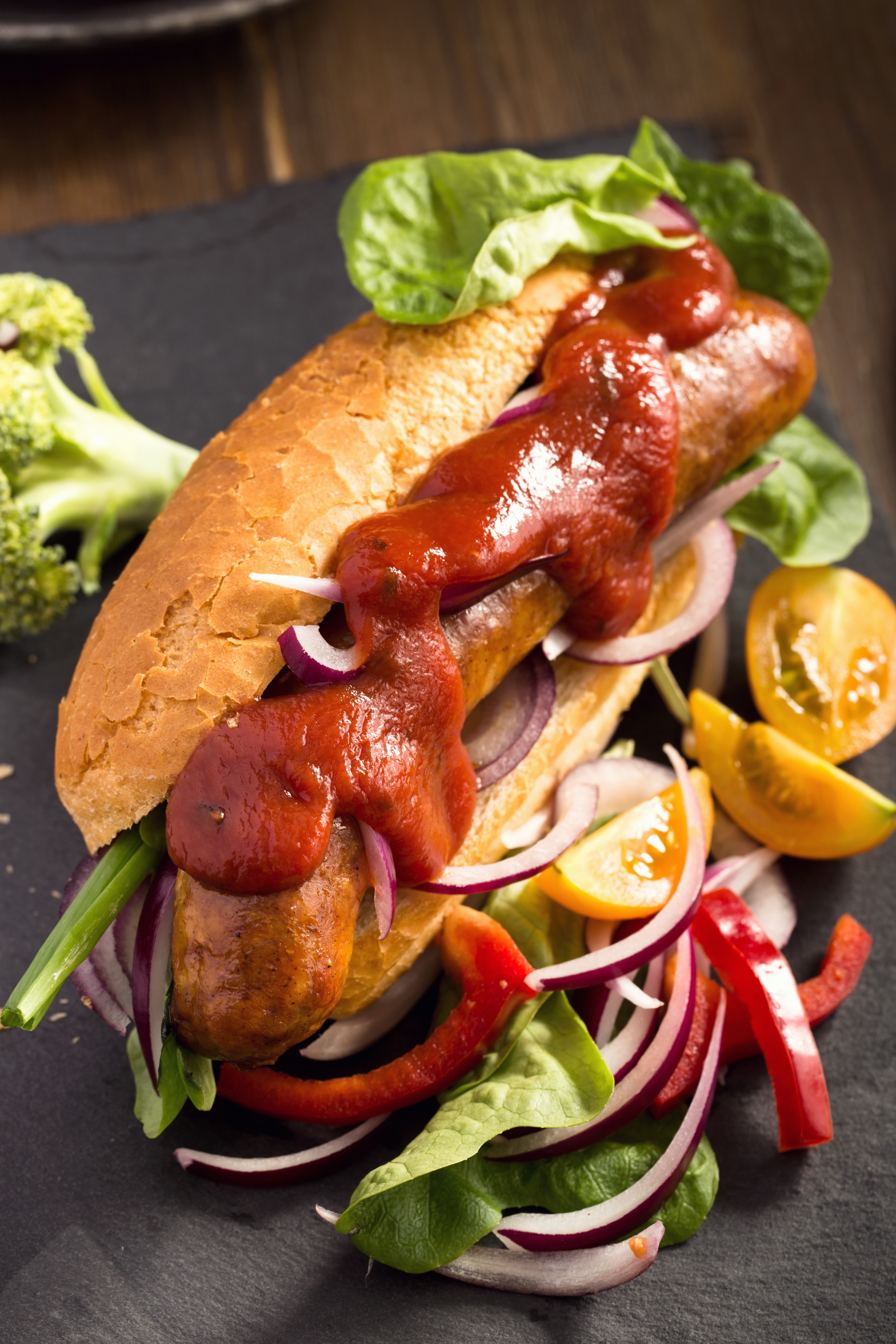 Hot dog with ketchup and vegetables HD Phone Wallpaper