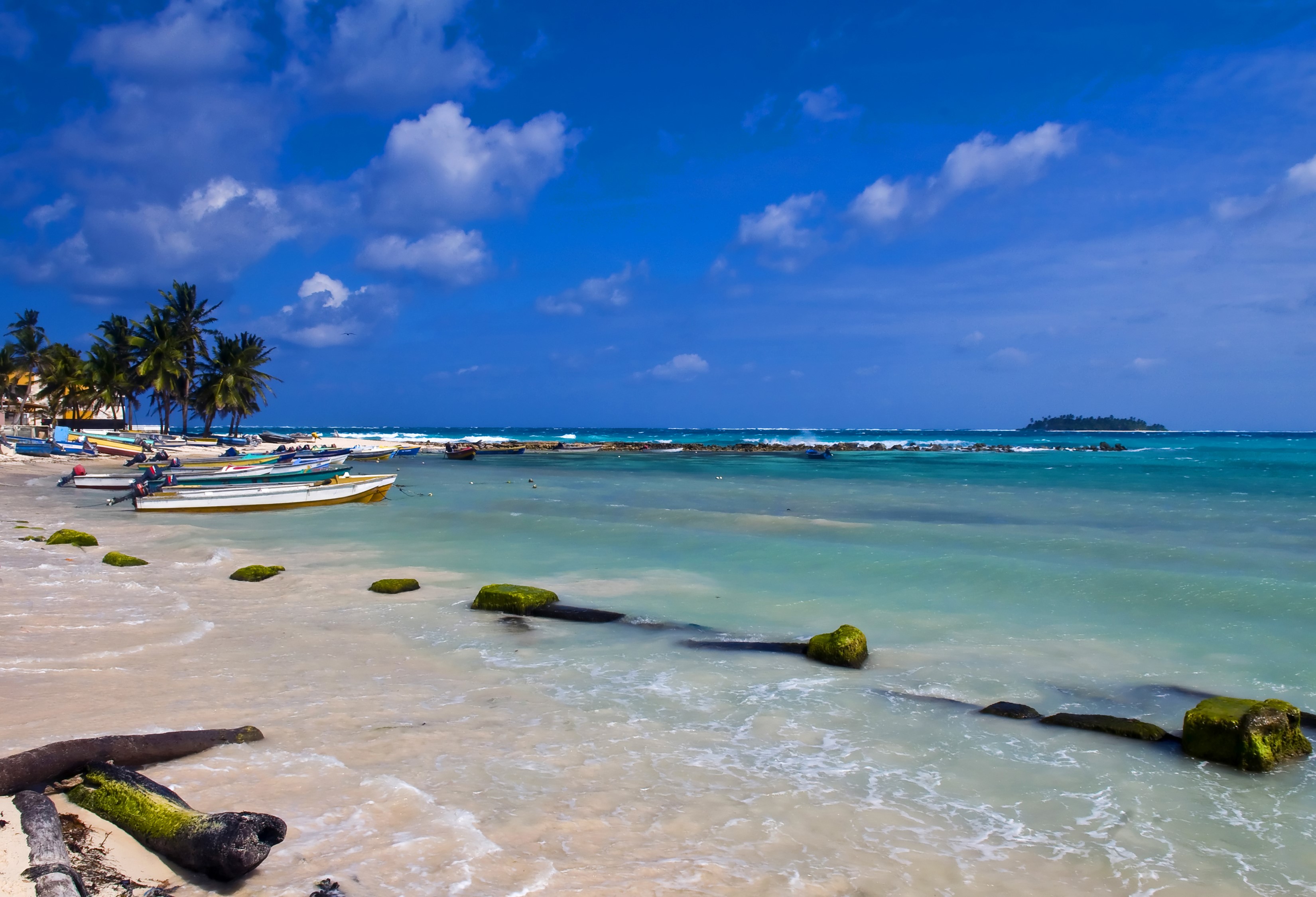 Boats on the coast of Colombia under a blue sky HD Wallpaper