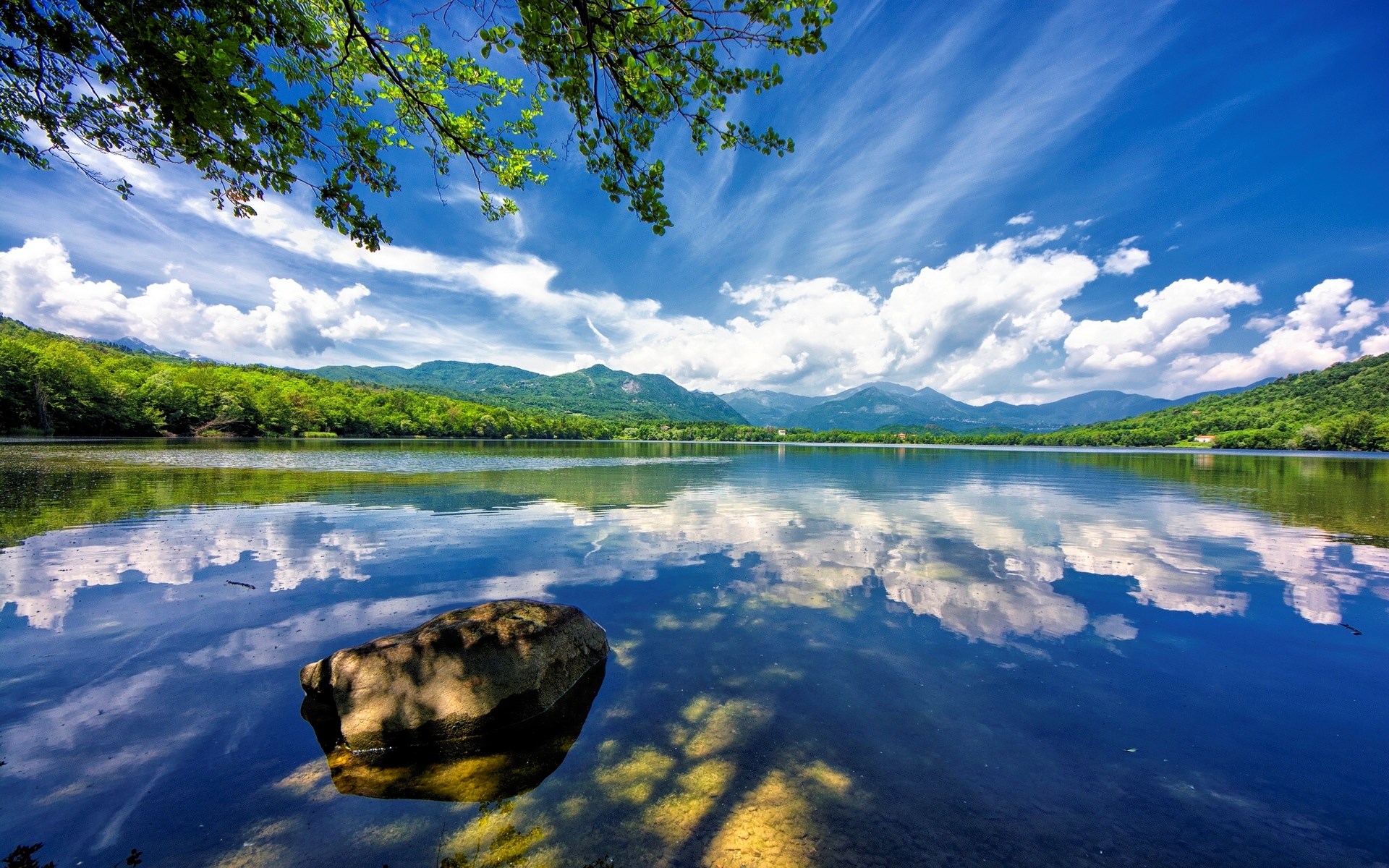 Lake with mountains and trees under a cloudy sky HD Wallpaper