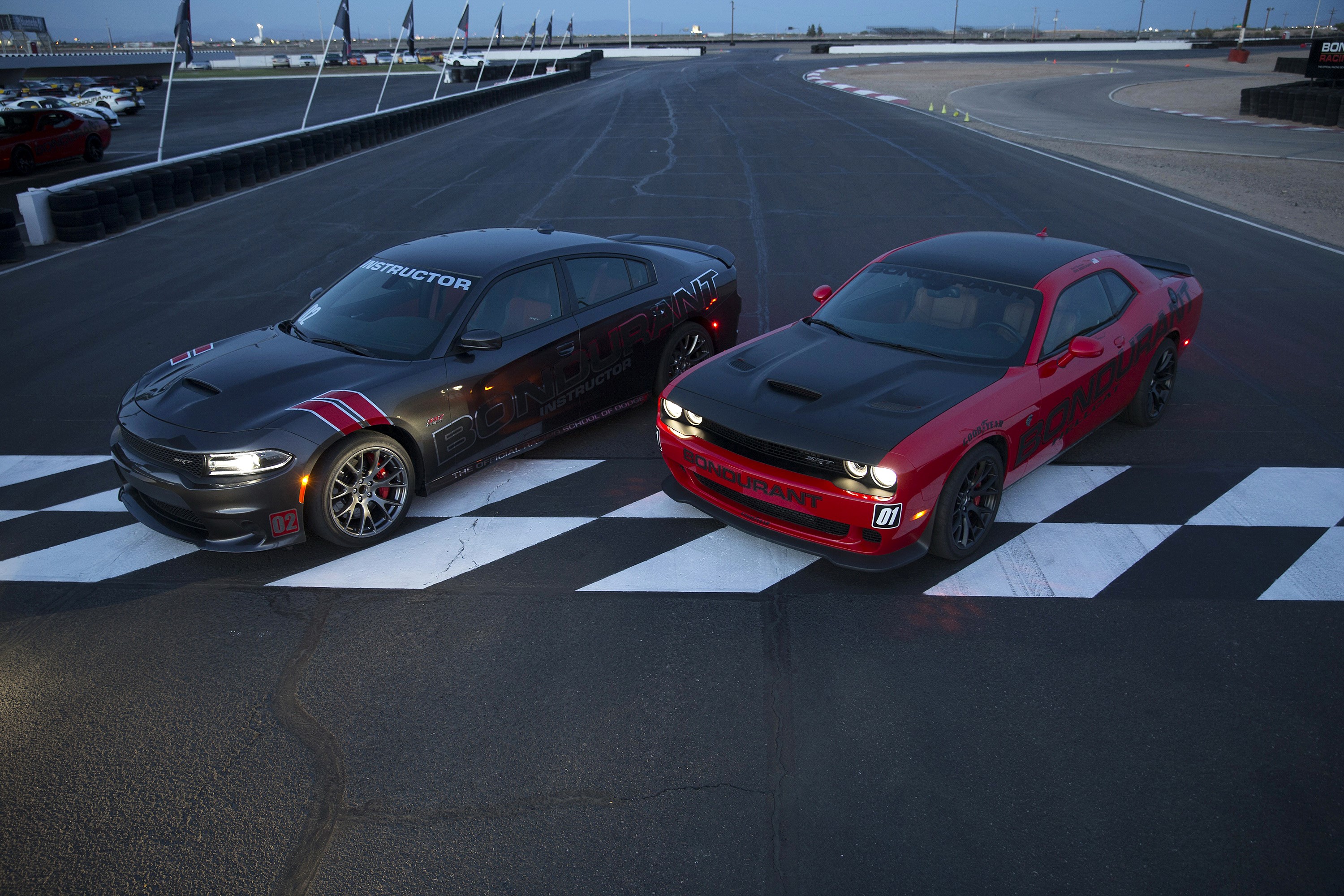 Two Dodge cars on a racetrack HD Wallpaper