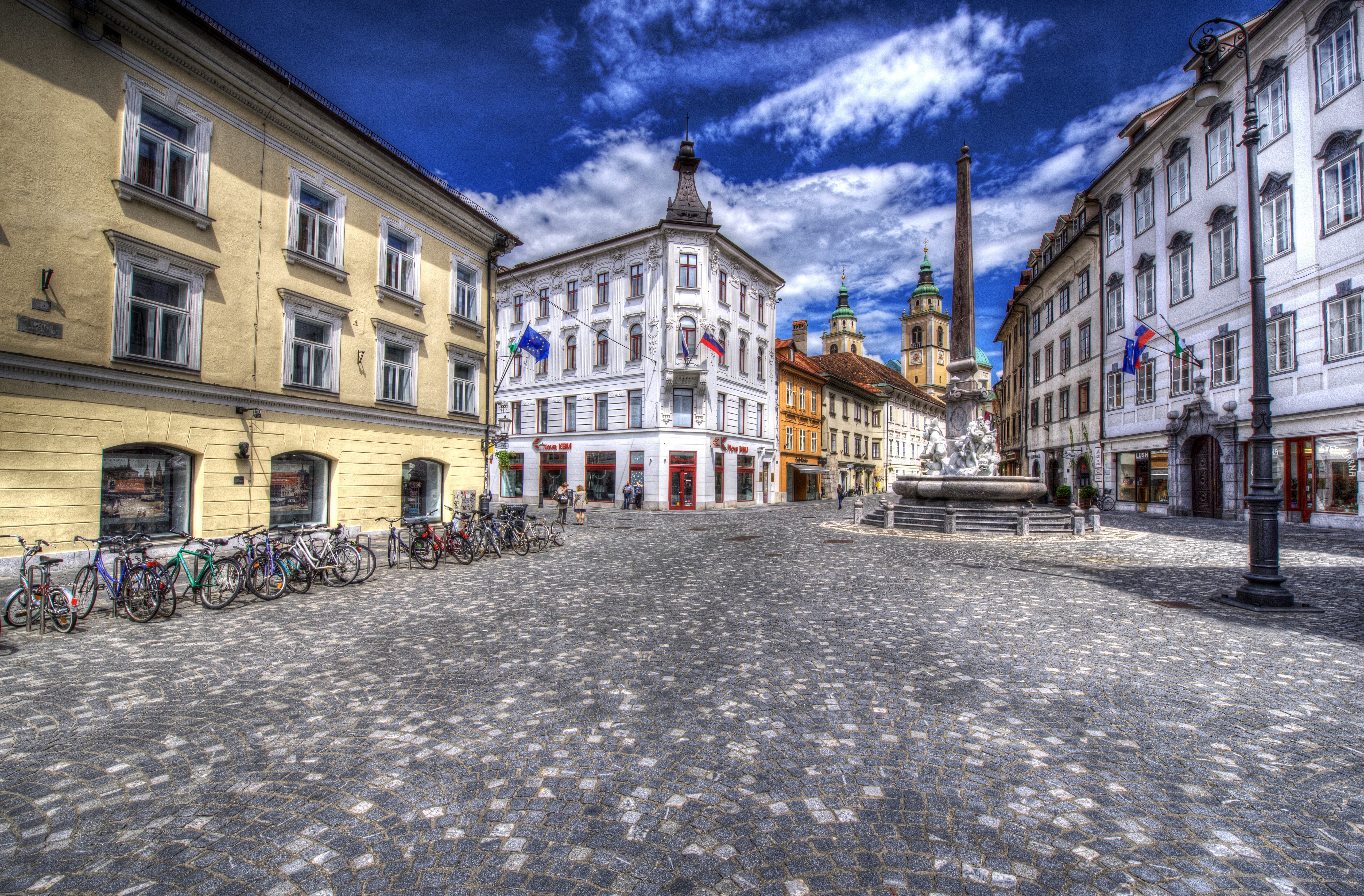 Ljubljana, Slovenia: Cobblestone Square with Fountain and Buildings HD Wallpaper