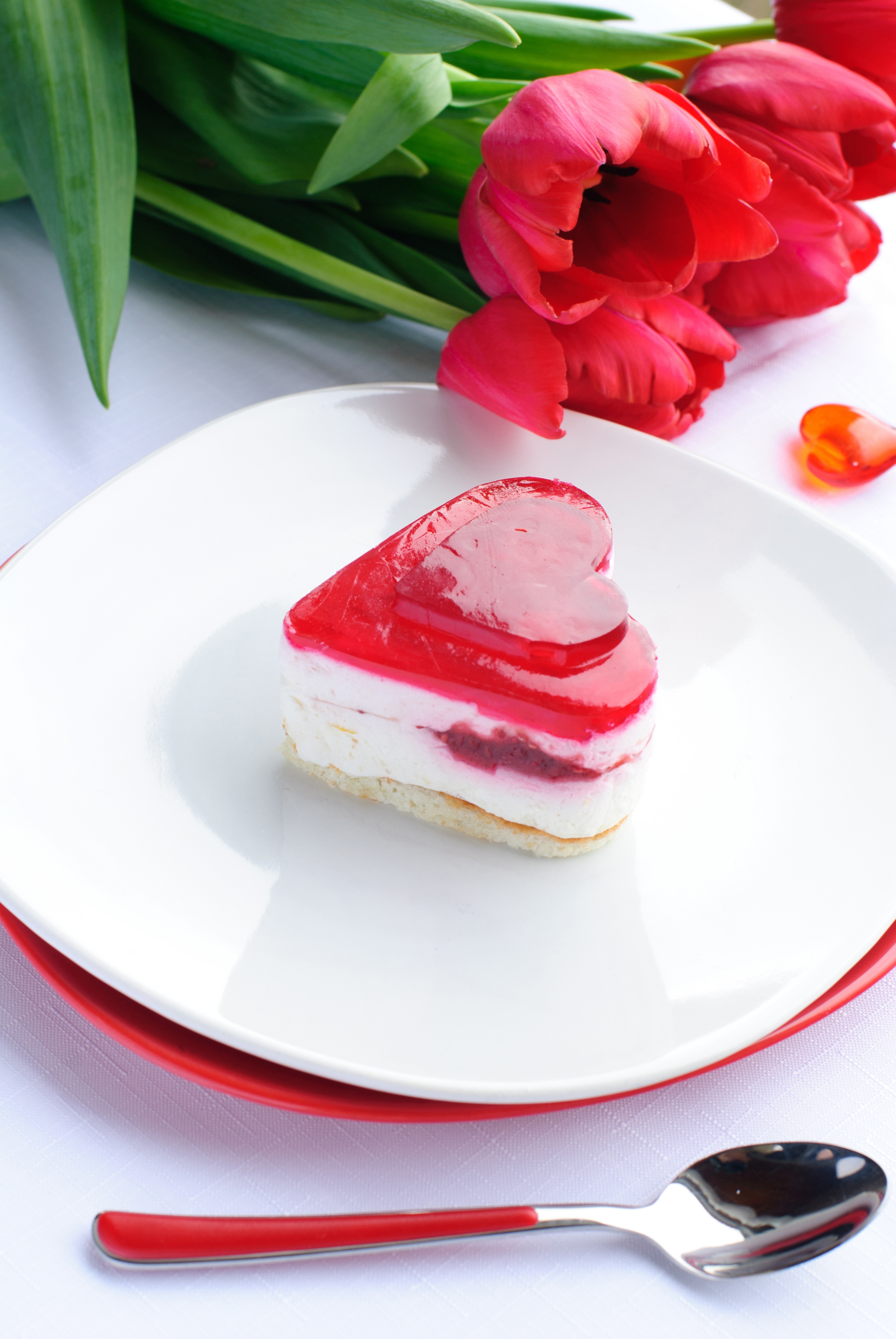 Heart-shaped cake with tulips and spoon HD Phone Wallpaper
