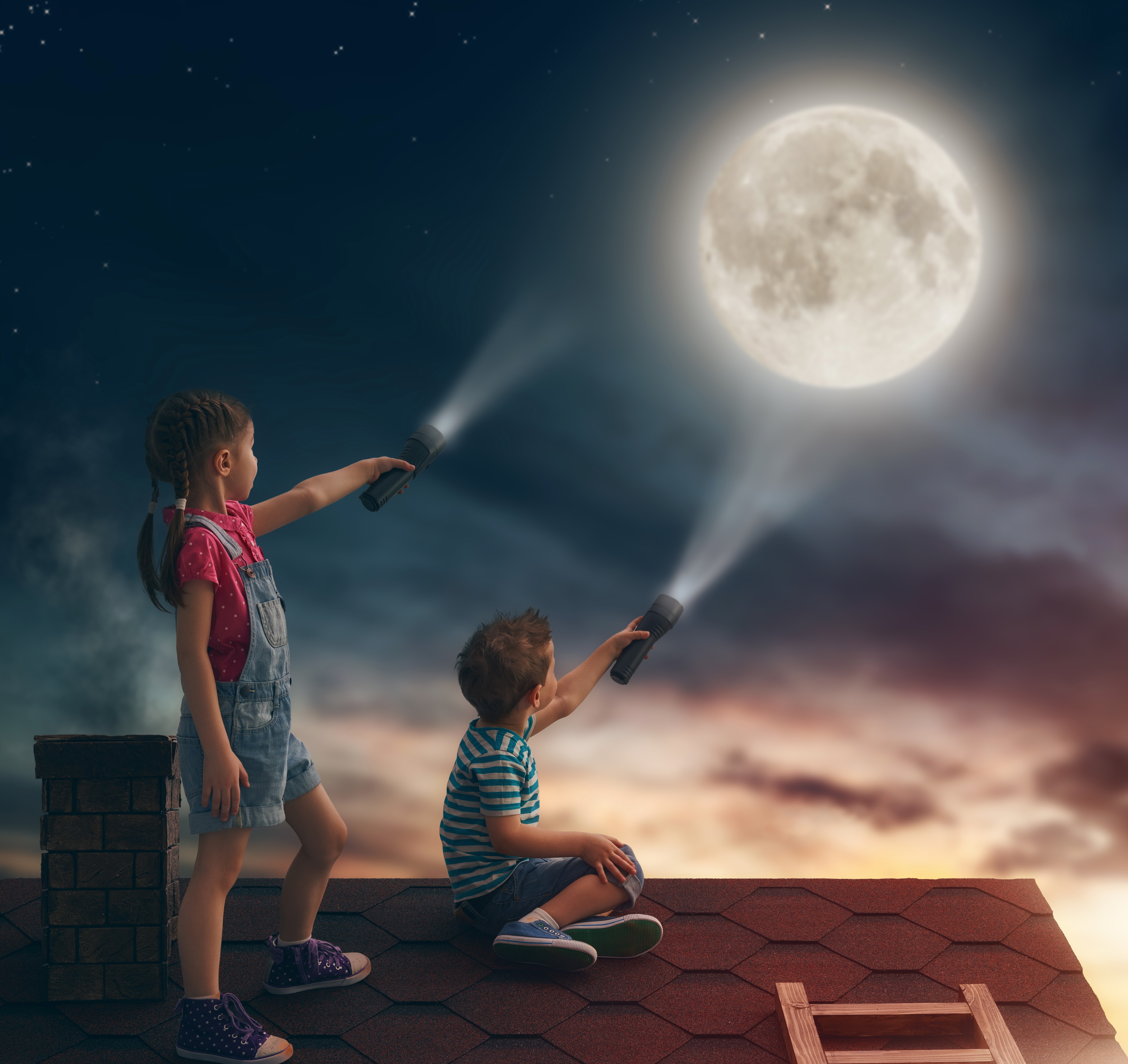Children with flashlights on roof at night looking at moon HD Wallpaper