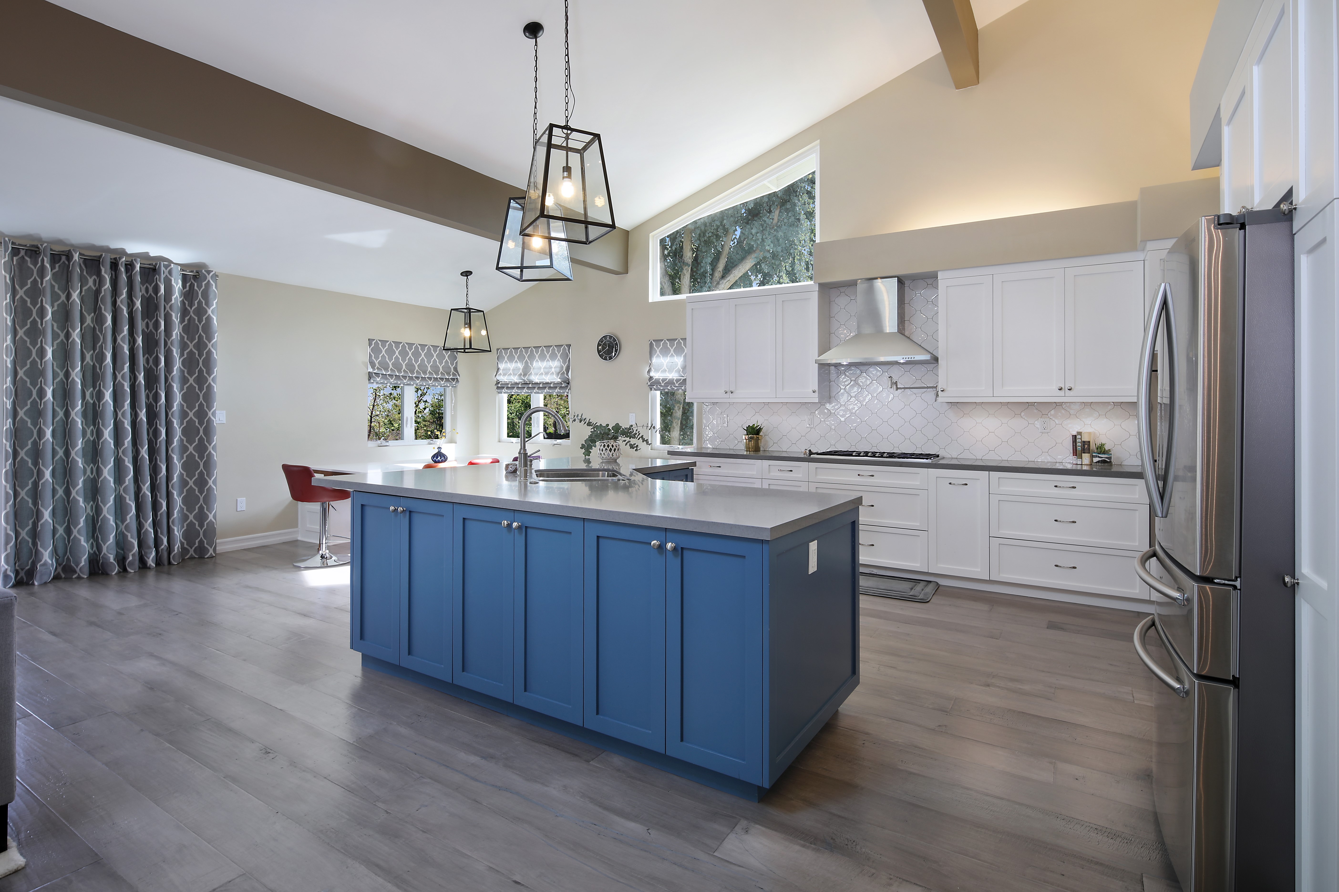 Modern Kitchen with Blue Island and Stainless Steel Appliances HD Wallpaper
