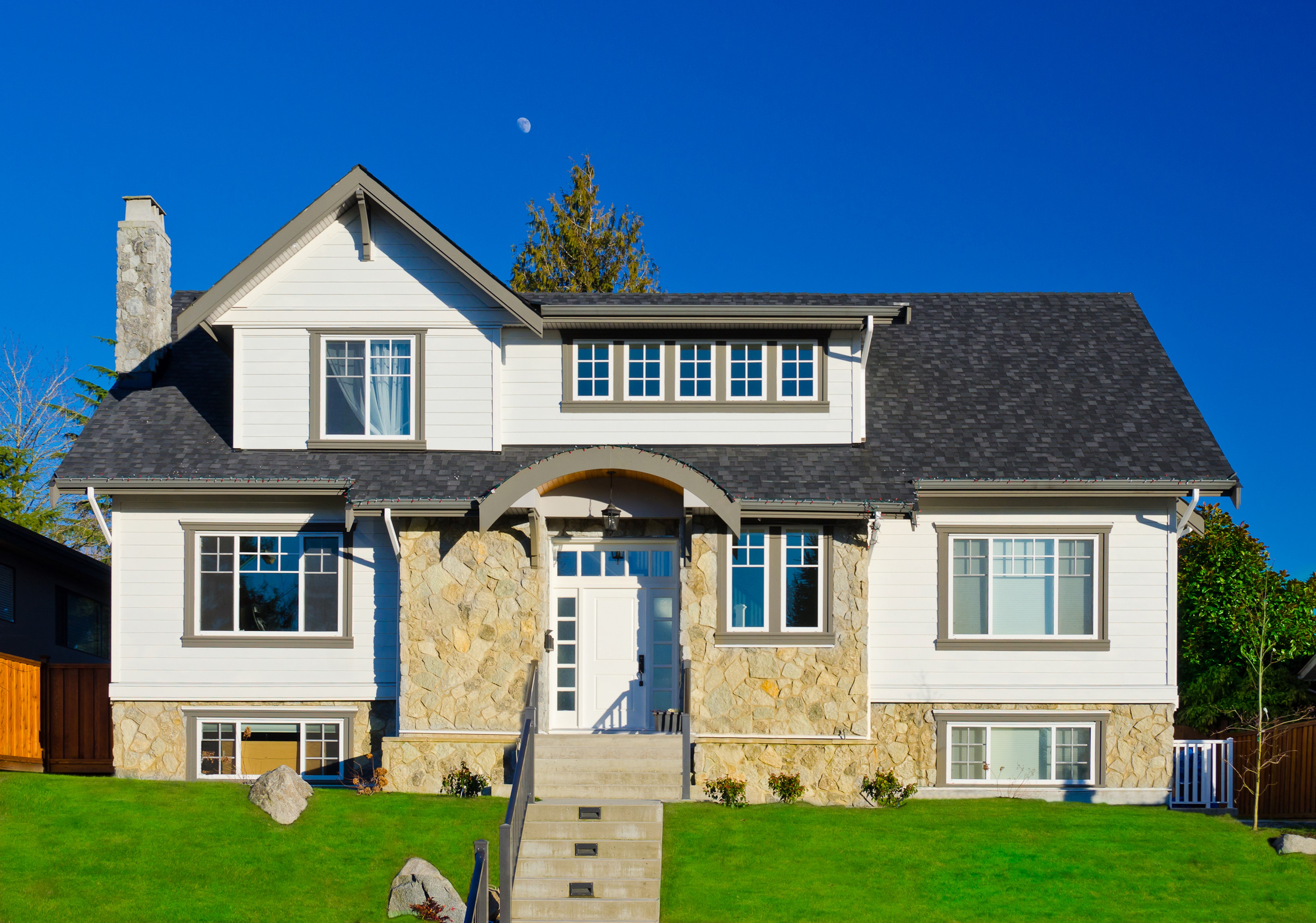 Modern House with Stone and White Siding HD Wallpaper