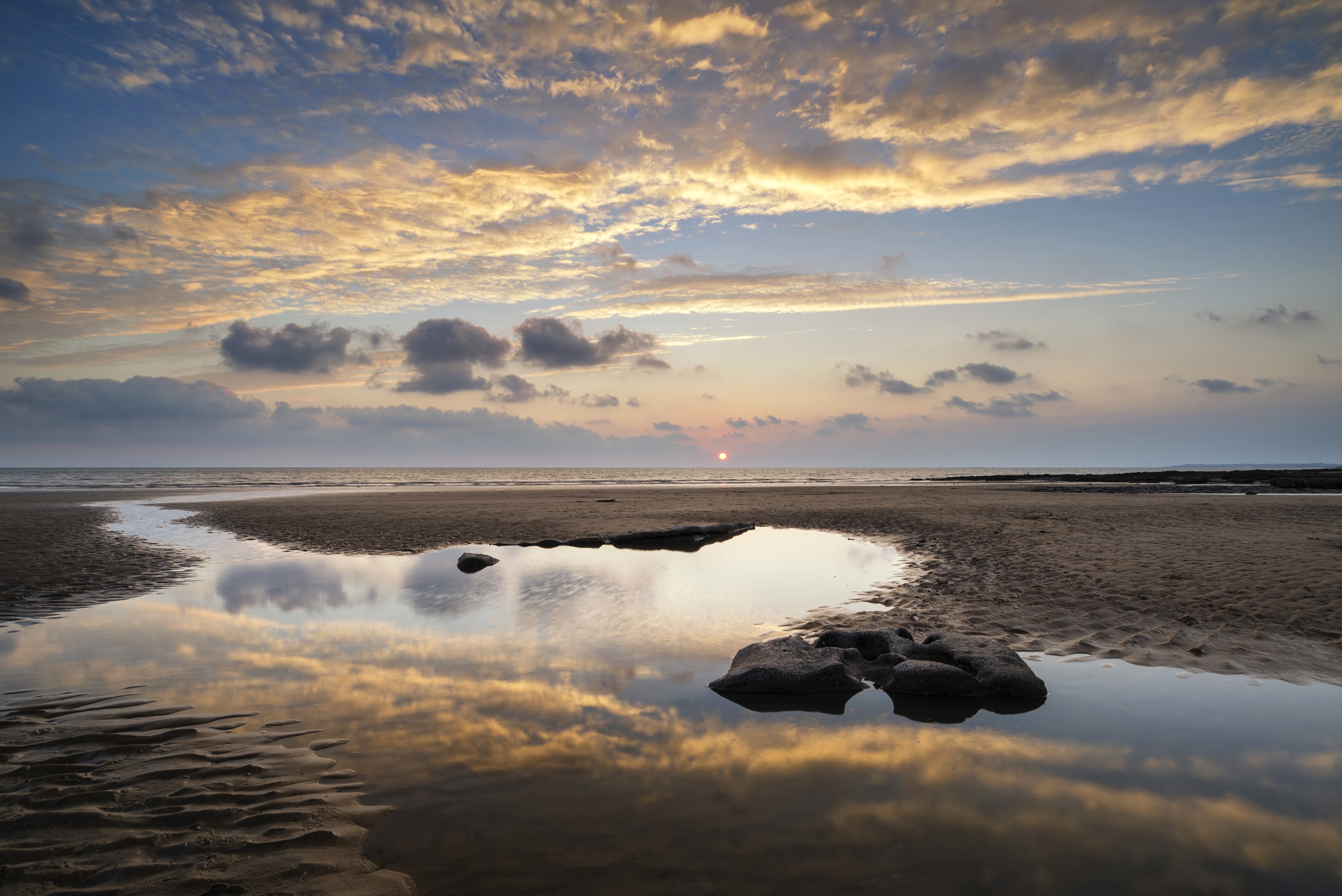 Sunset over Dunraven Bay, Wales, with reflections in puddles HD Wallpaper
