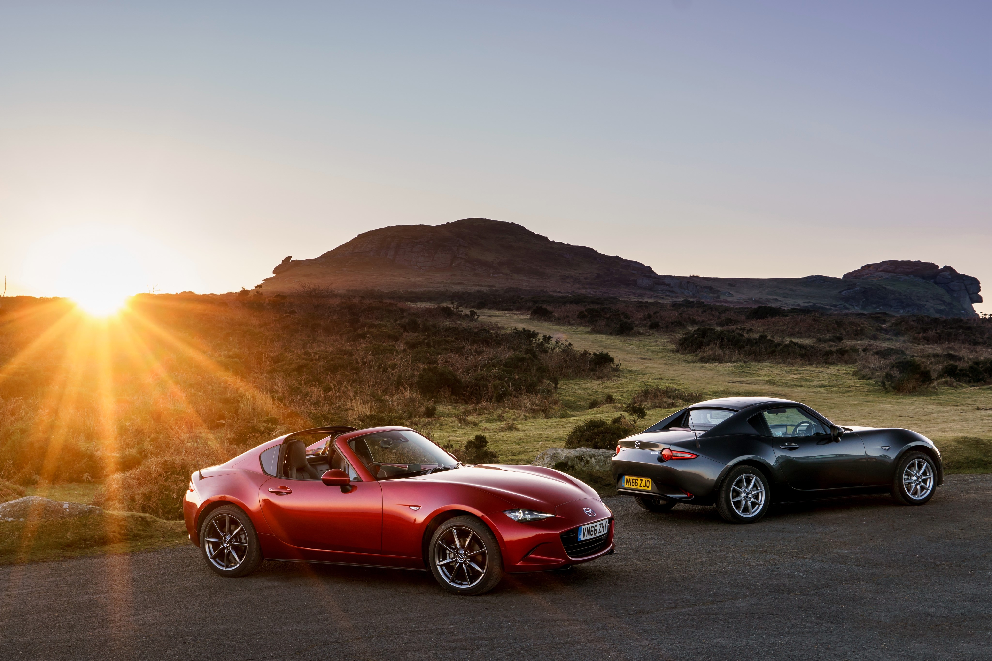 Two Mazda MX-5 RF cars at sunset HD Wallpaper