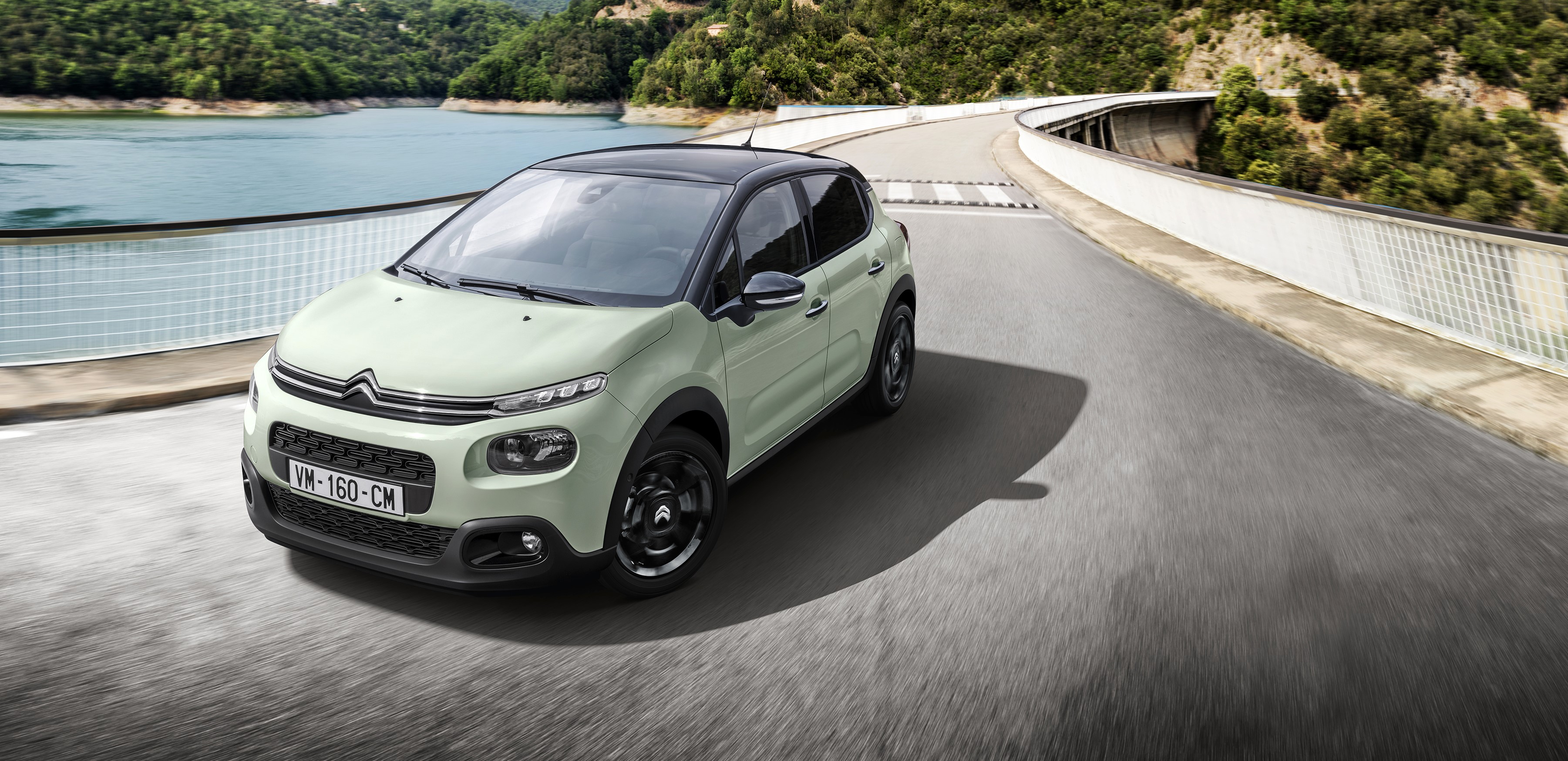 Citroen C3 on a winding road HD Wallpaper