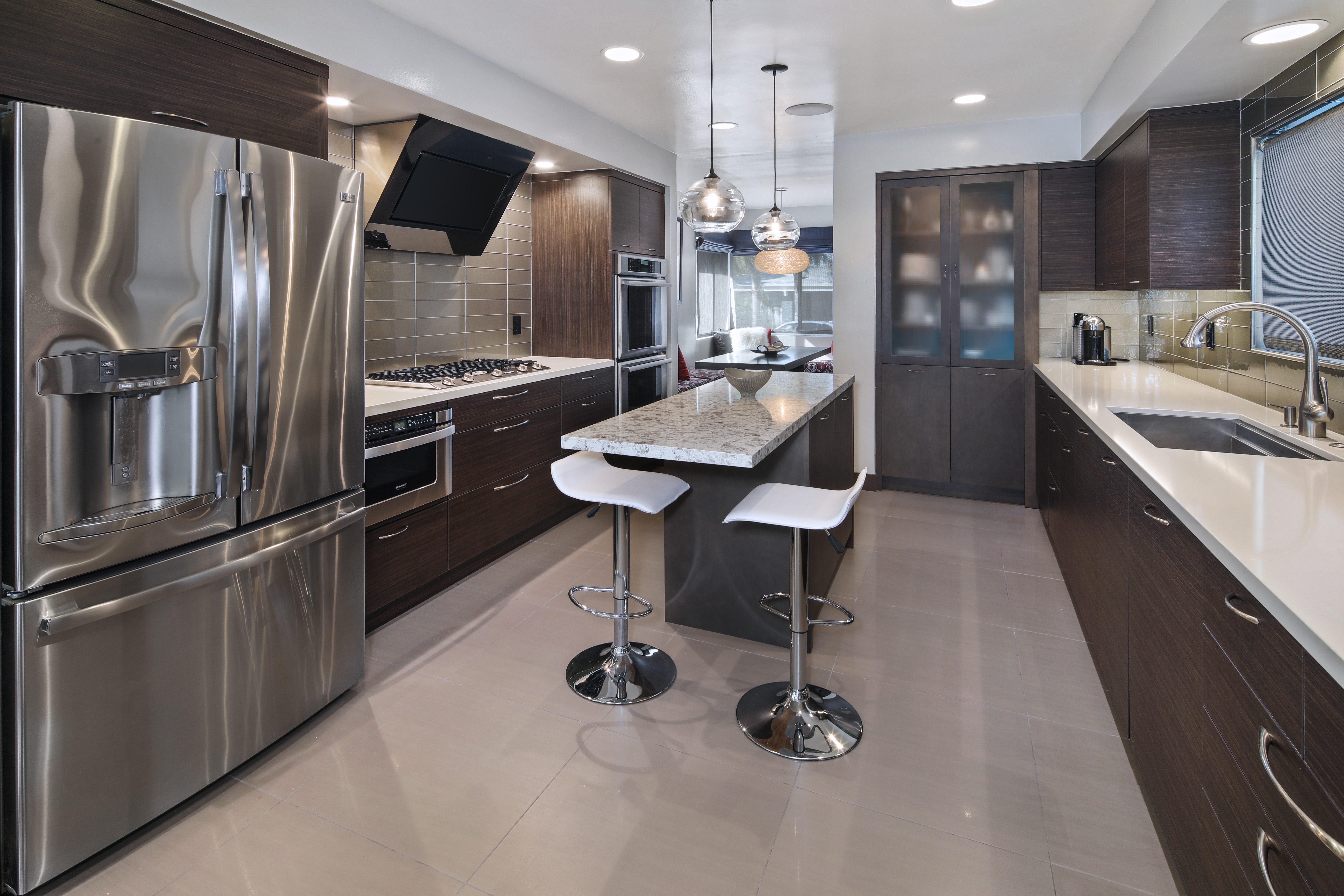 Modern Kitchen with Island and Stainless Steel Appliances HD Wallpaper