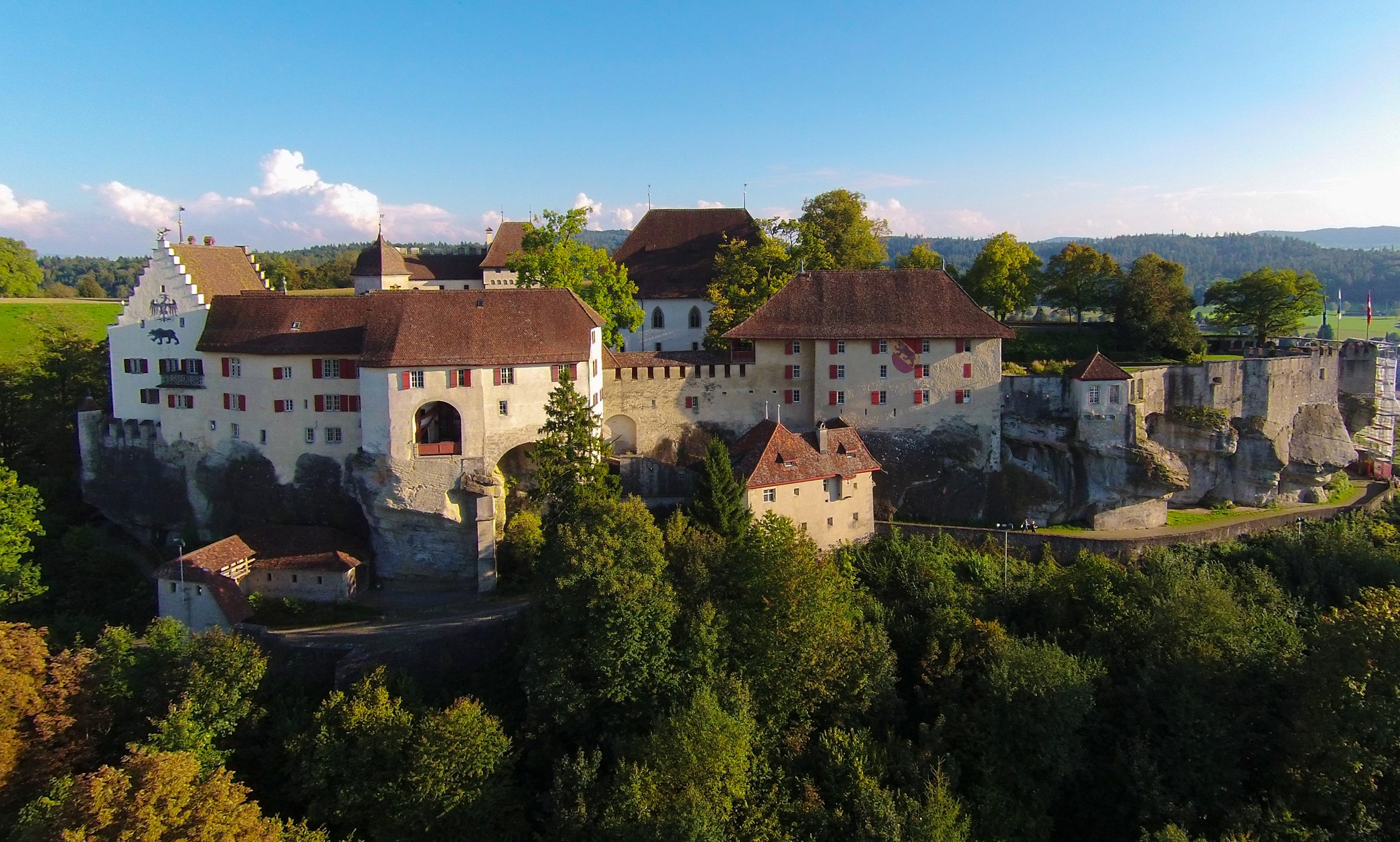 Lenzburg Castle in Switzerland with surrounding trees HD Wallpaper