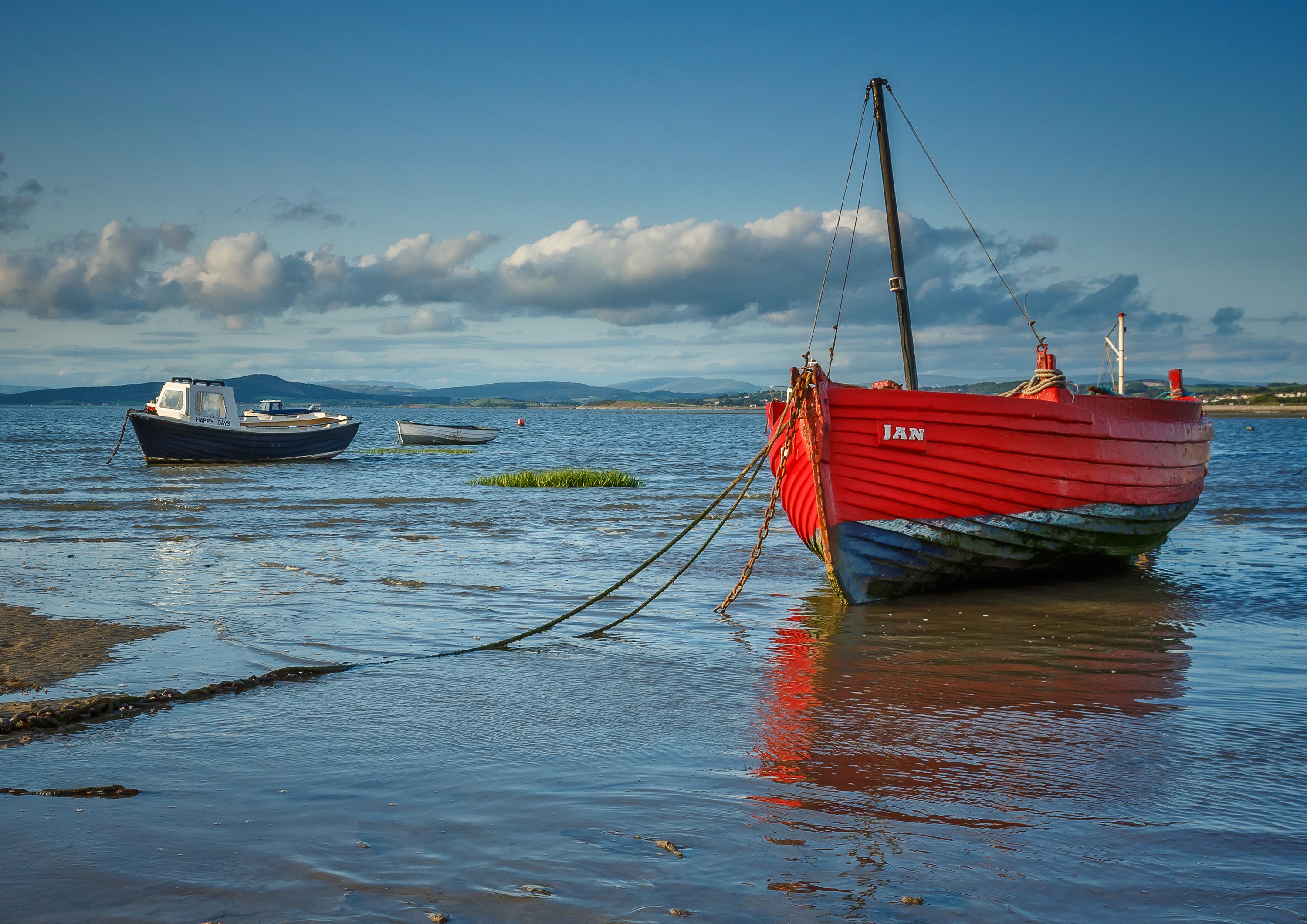 Red fishing boat named Jan moored in Morecambe Bay, UK HD Wallpaper