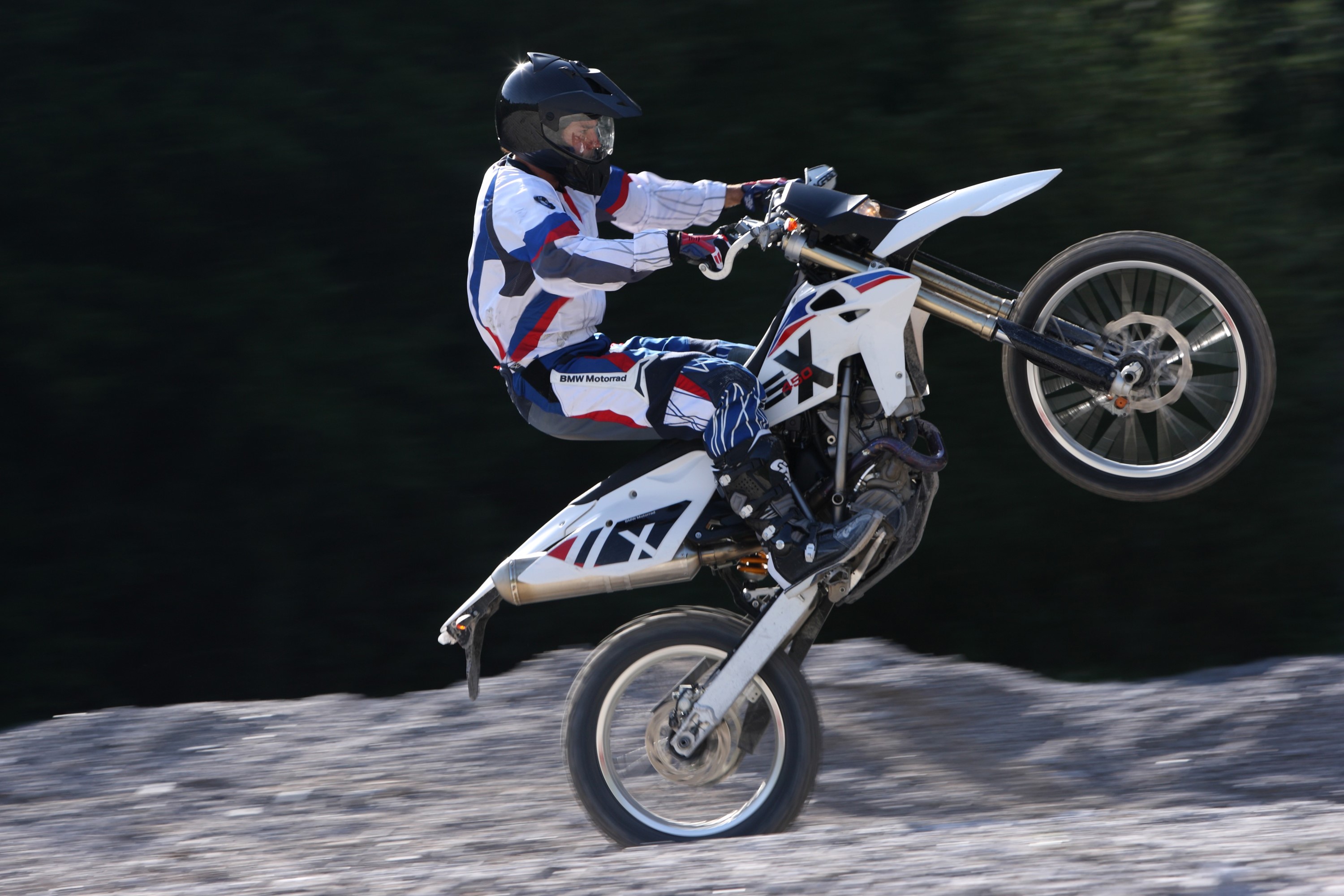 Motorcyclist performing a wheelie on a BMW G 450 X HD Wallpaper