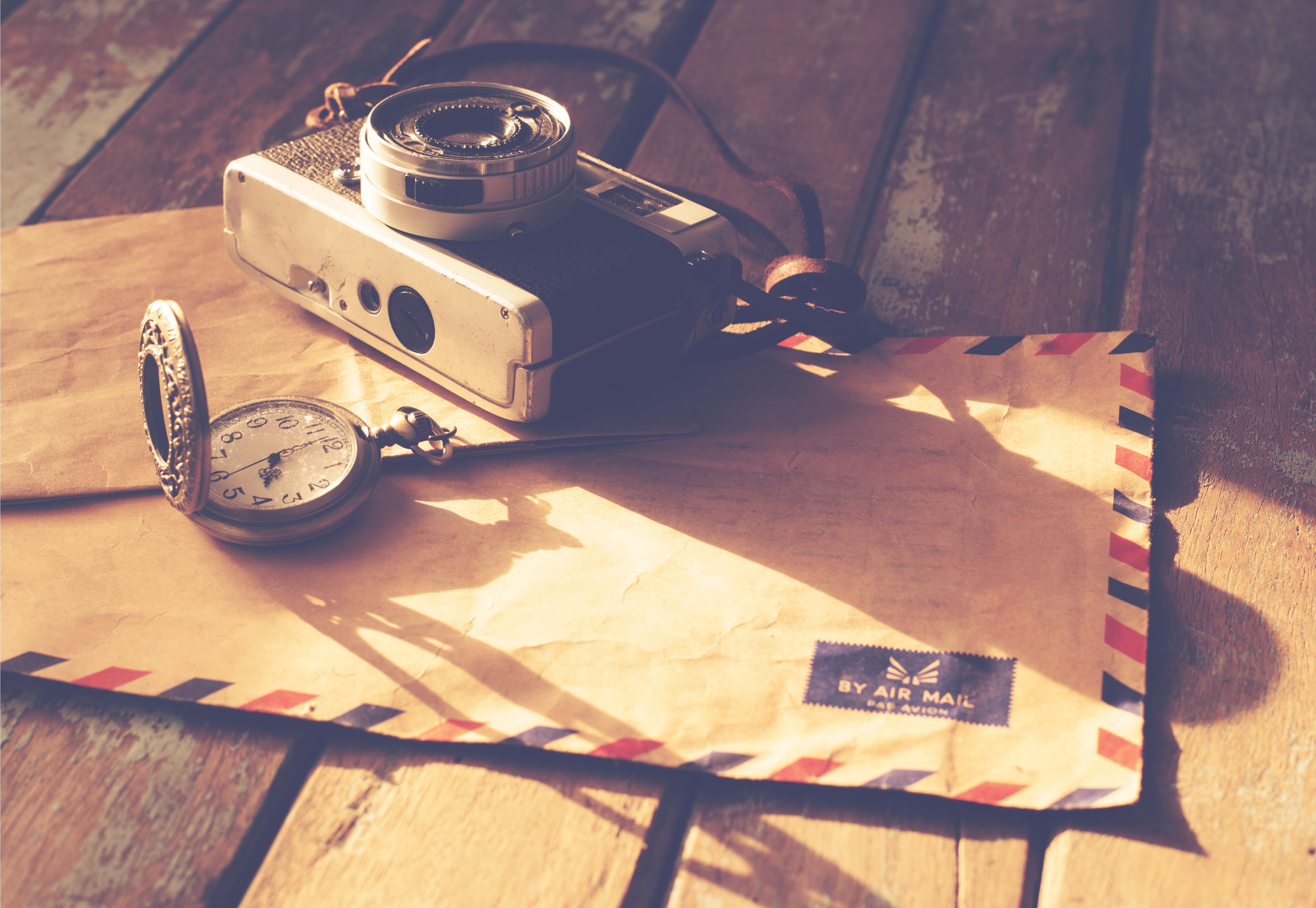 Retro camera and pocket watch on air mail envelope HD Wallpaper