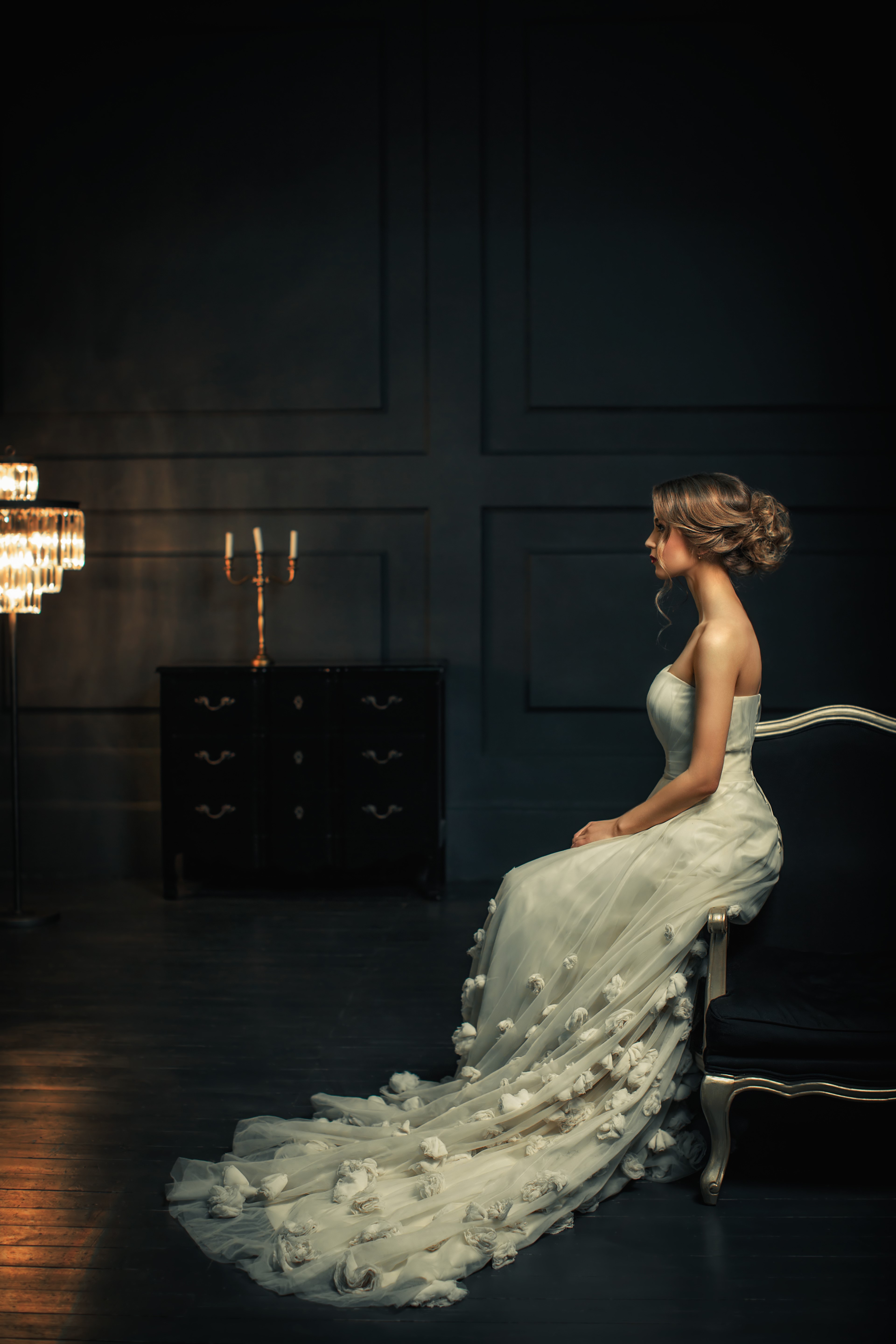 Woman in a white dress sitting on a couch HD Phone Wallpaper
