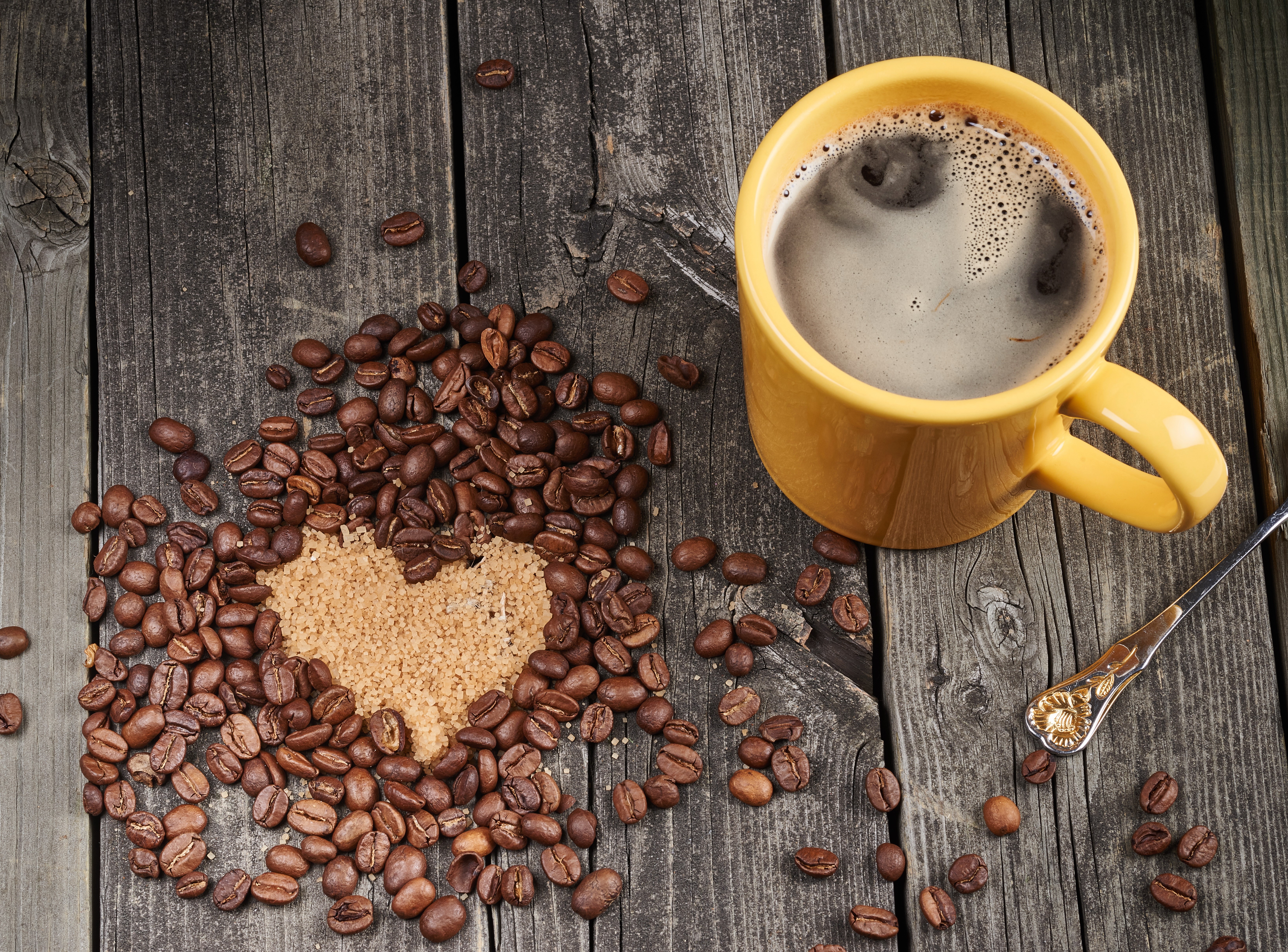 Coffee beans and mug on wood planks HD Wallpaper