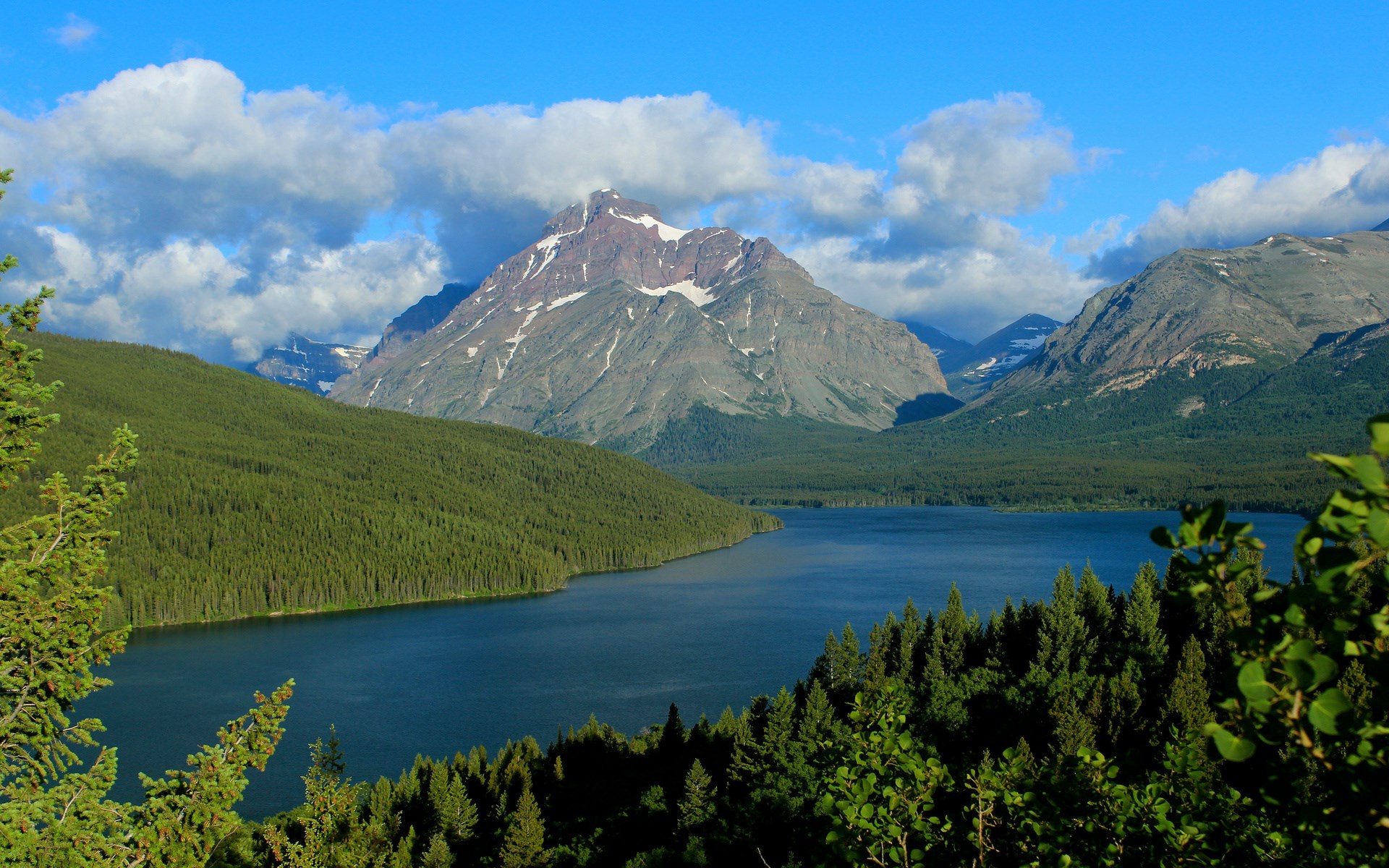 Lake and mountains with pine forest under blue sky HD Wallpaper